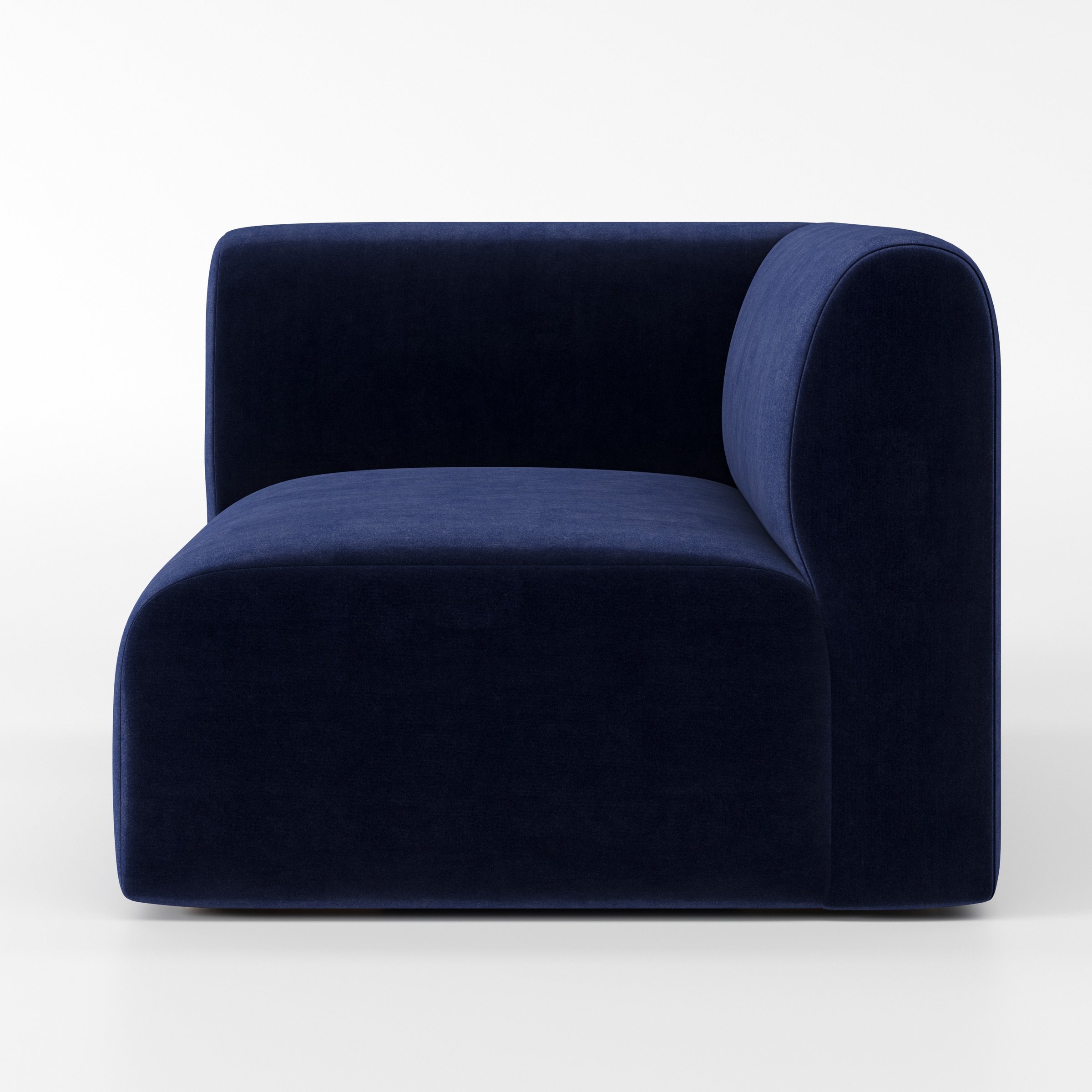 Drumquin modular sofa corner unit in Noss Velvet Navy shown from the right highlighting the wraparound back and soft, sculpted form.