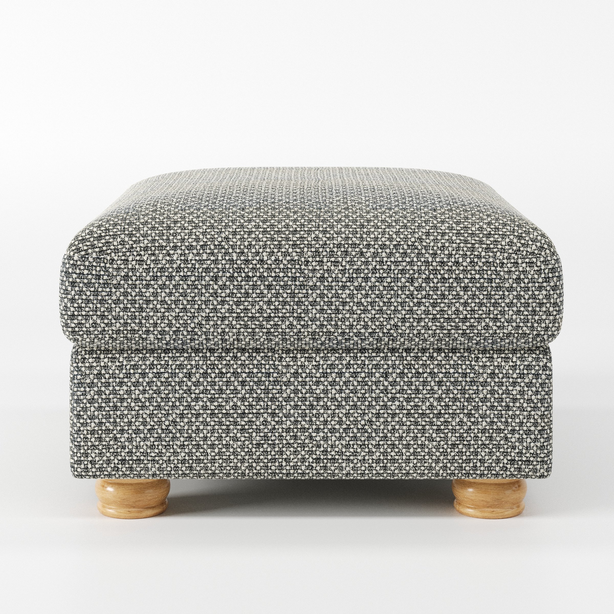 Anna Lee footstool in Rousay Wool Blend Tar and Chalk shown front-on against a neutral studio backdrop.
