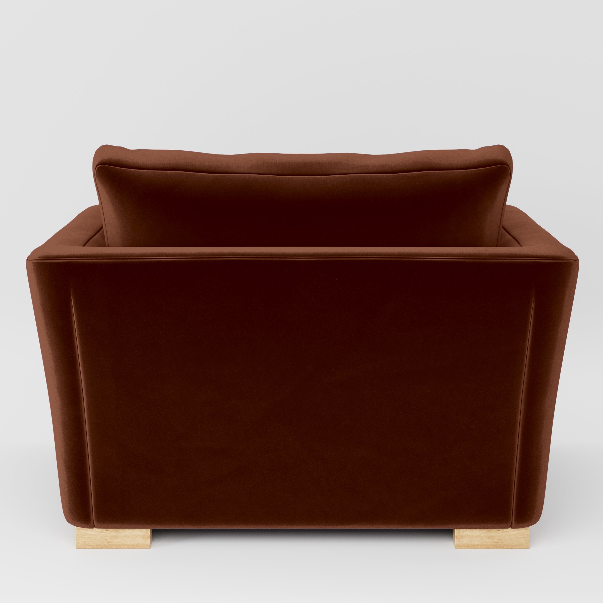 Rear view of the Stowe armchair upholstered in Plush EasyClean Velvet in Maple.