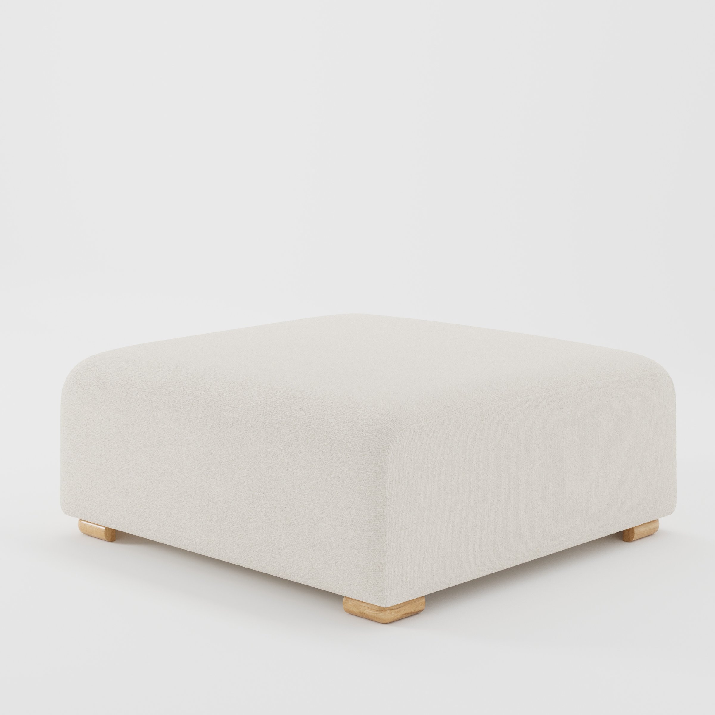 Tay footstool in Kilda Boucle Cream shown at a diagonal angle highlighting clean edges and compact form.