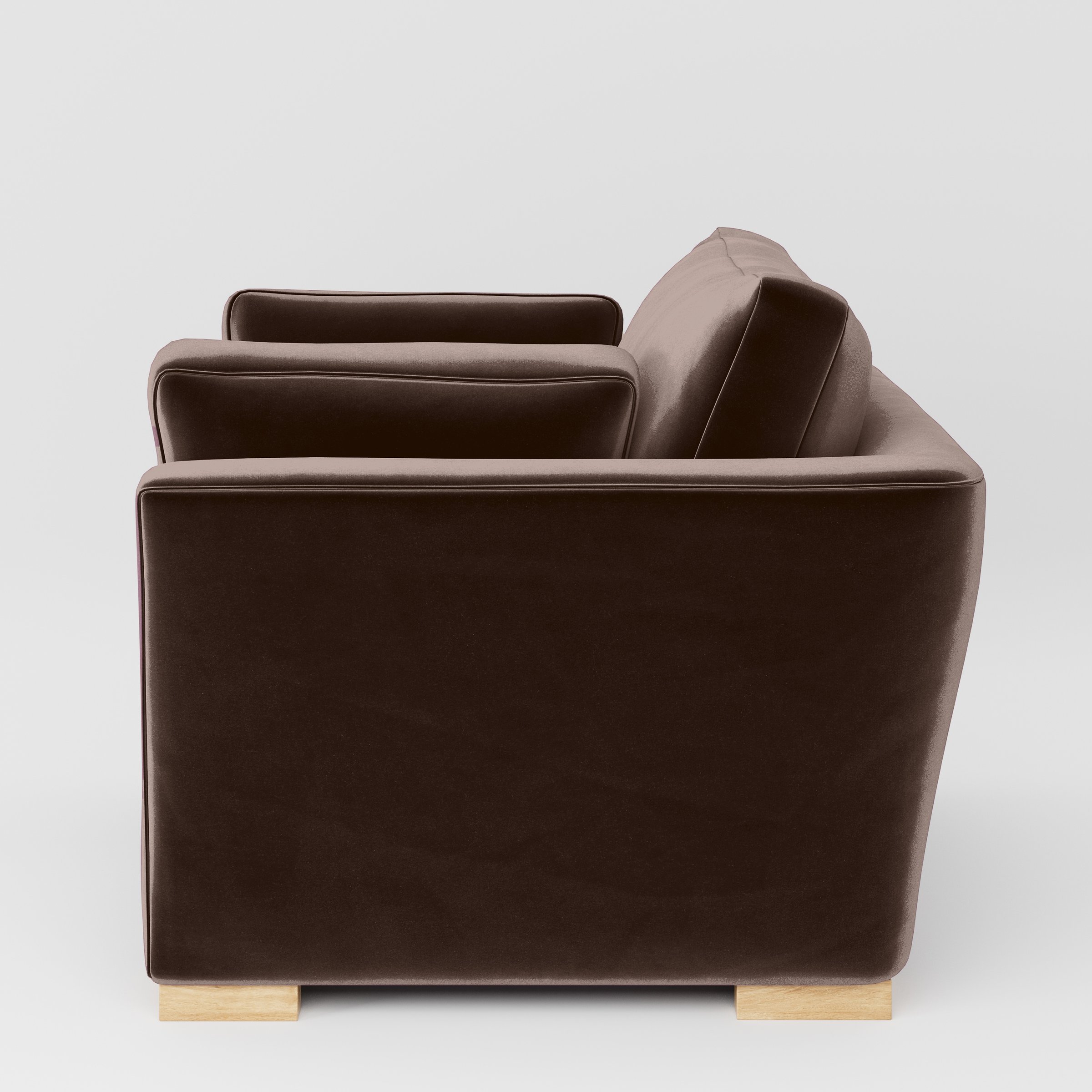 Side view of the Stowe armchair upholstered in Plush EasyClean Velvet in Mole.