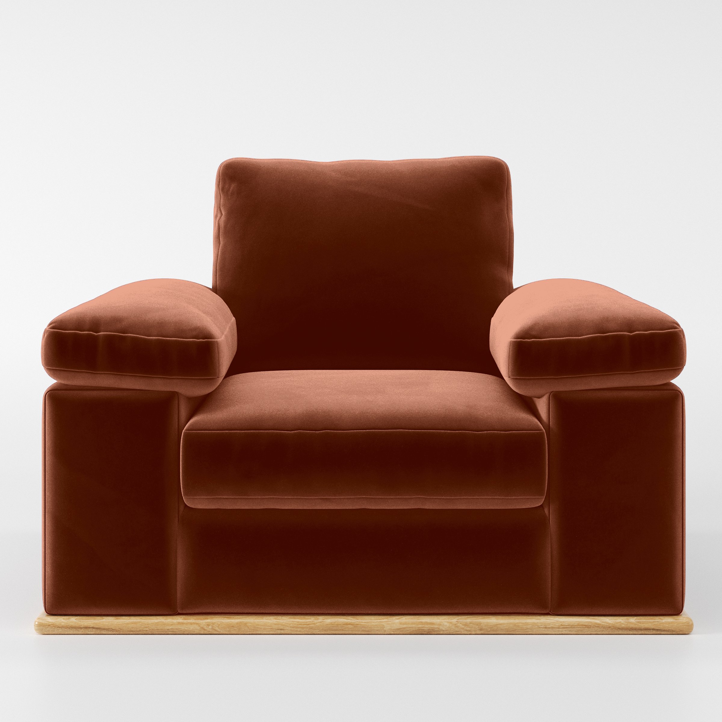 Front view of the Cusher armchair upholstered in Plush EasyClean Velvet in Apricot.