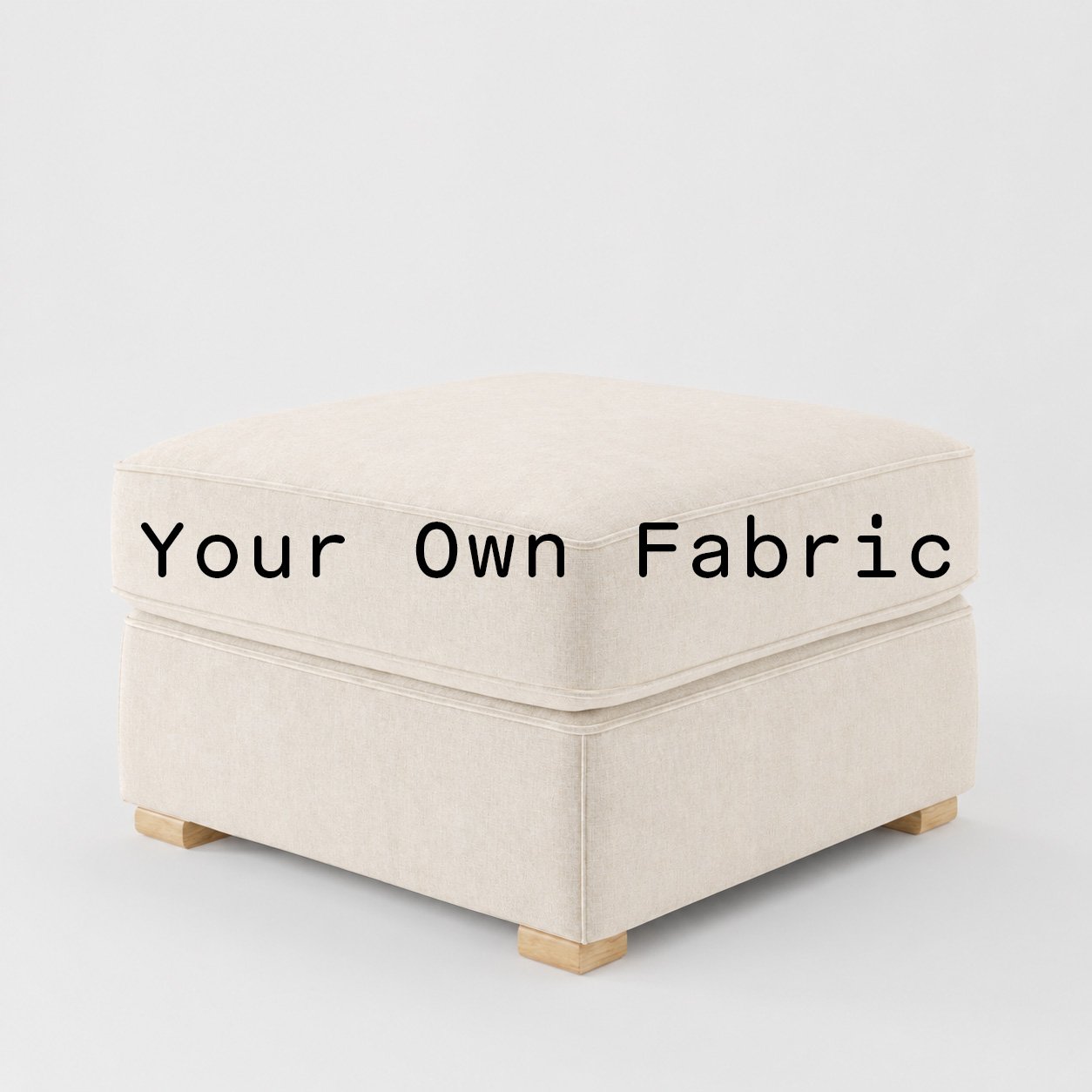 Diagonal view of the Cashel footstool upholstered in customers own material calico cotton fabric.