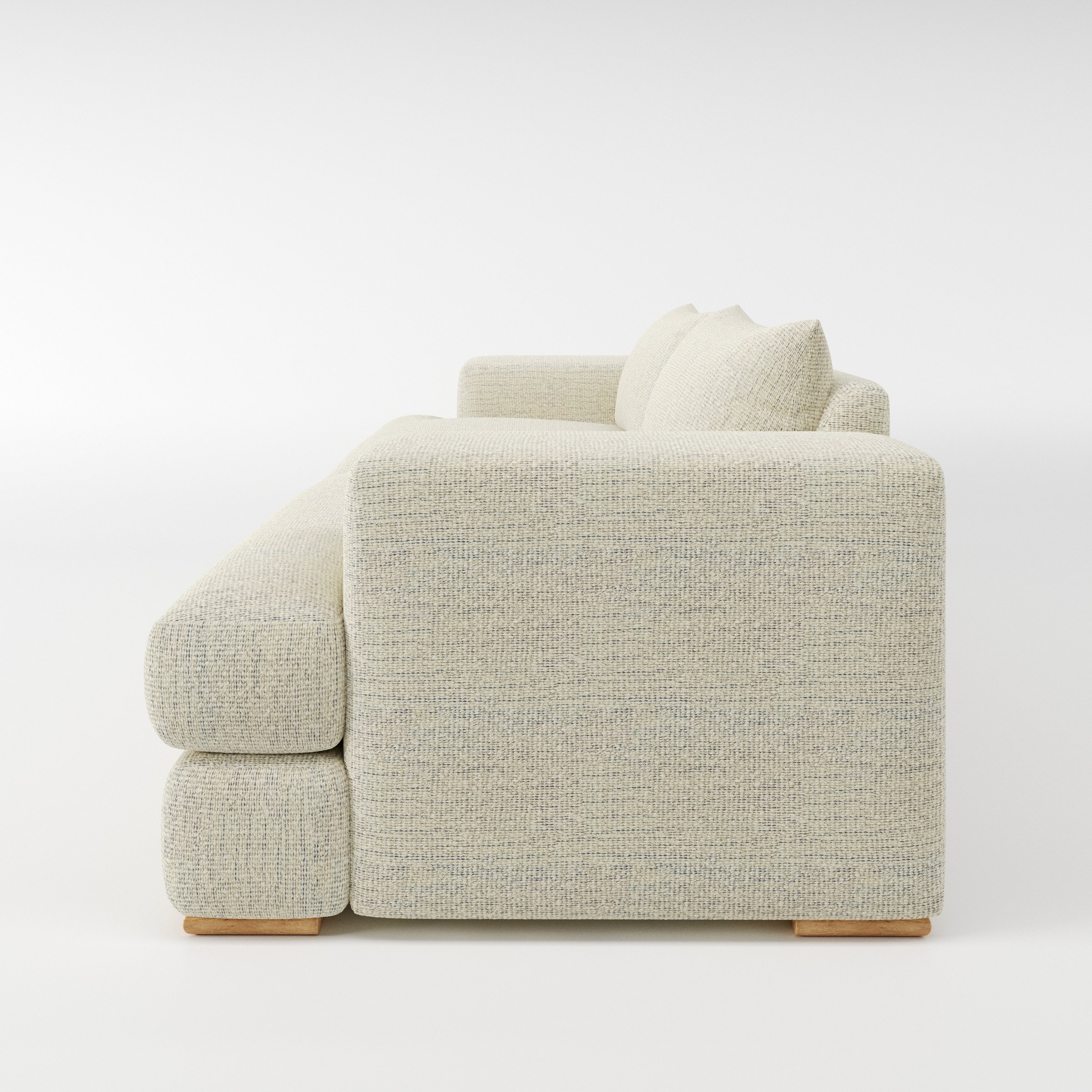 Fane sofa in Orsay Boucle Cream and Marine shown in side profile displaying proportions and overall silhouette.