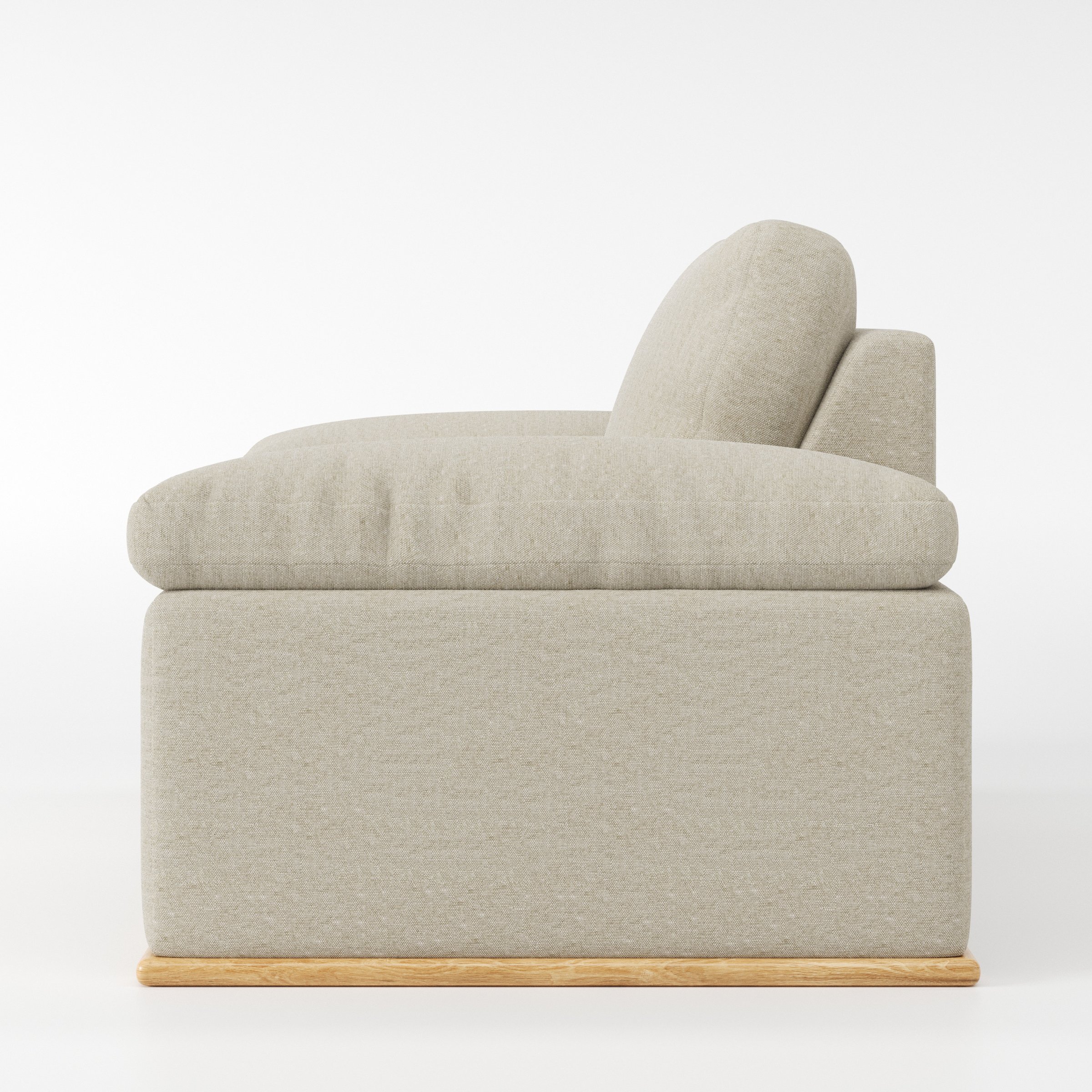 Cusher armchair in Alderney Linen Oatmeal shown in side profile displaying proportions and overall silhouette.