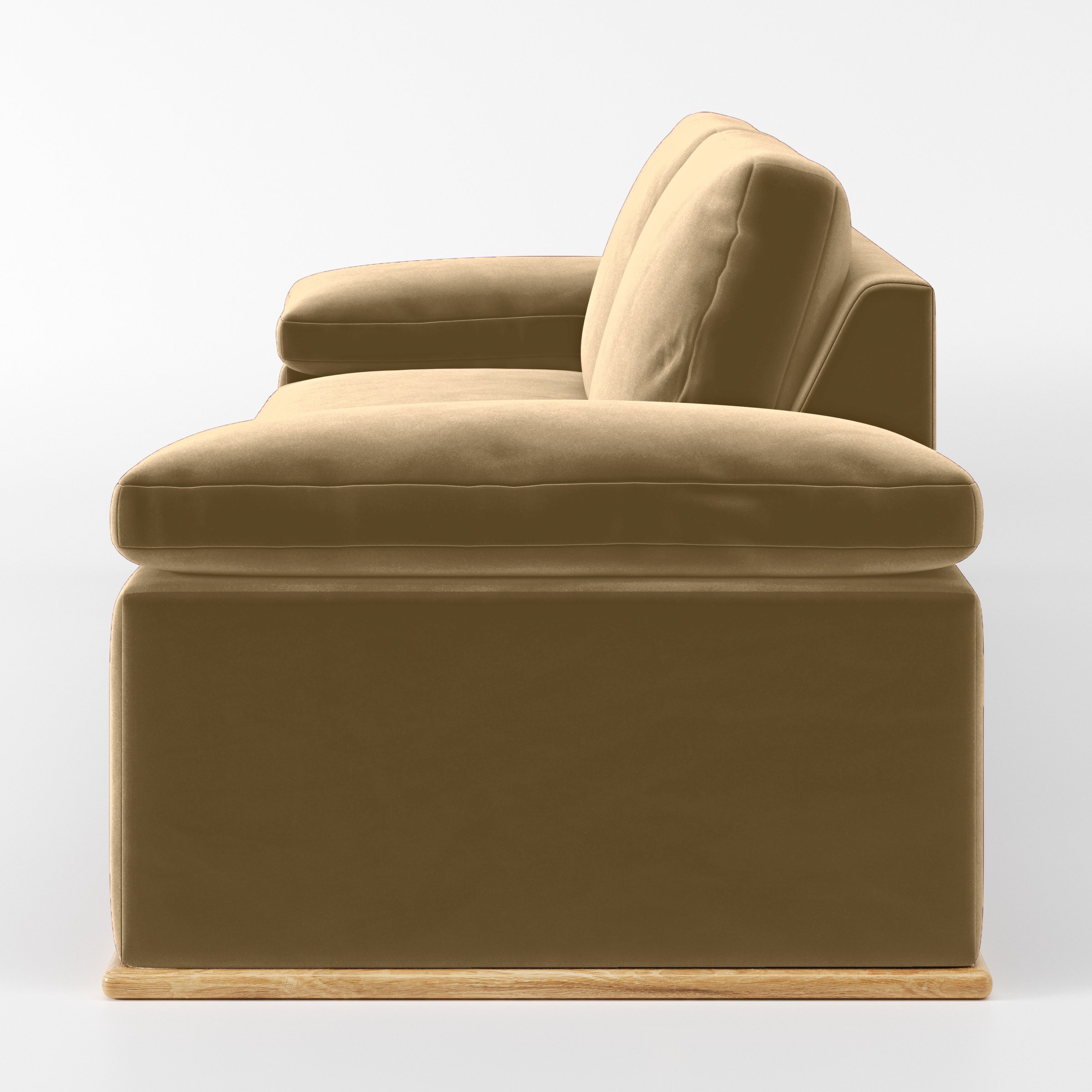 Side view of the Cusher sofa upholstered in Plush EasyClean Velvet in Cafe.