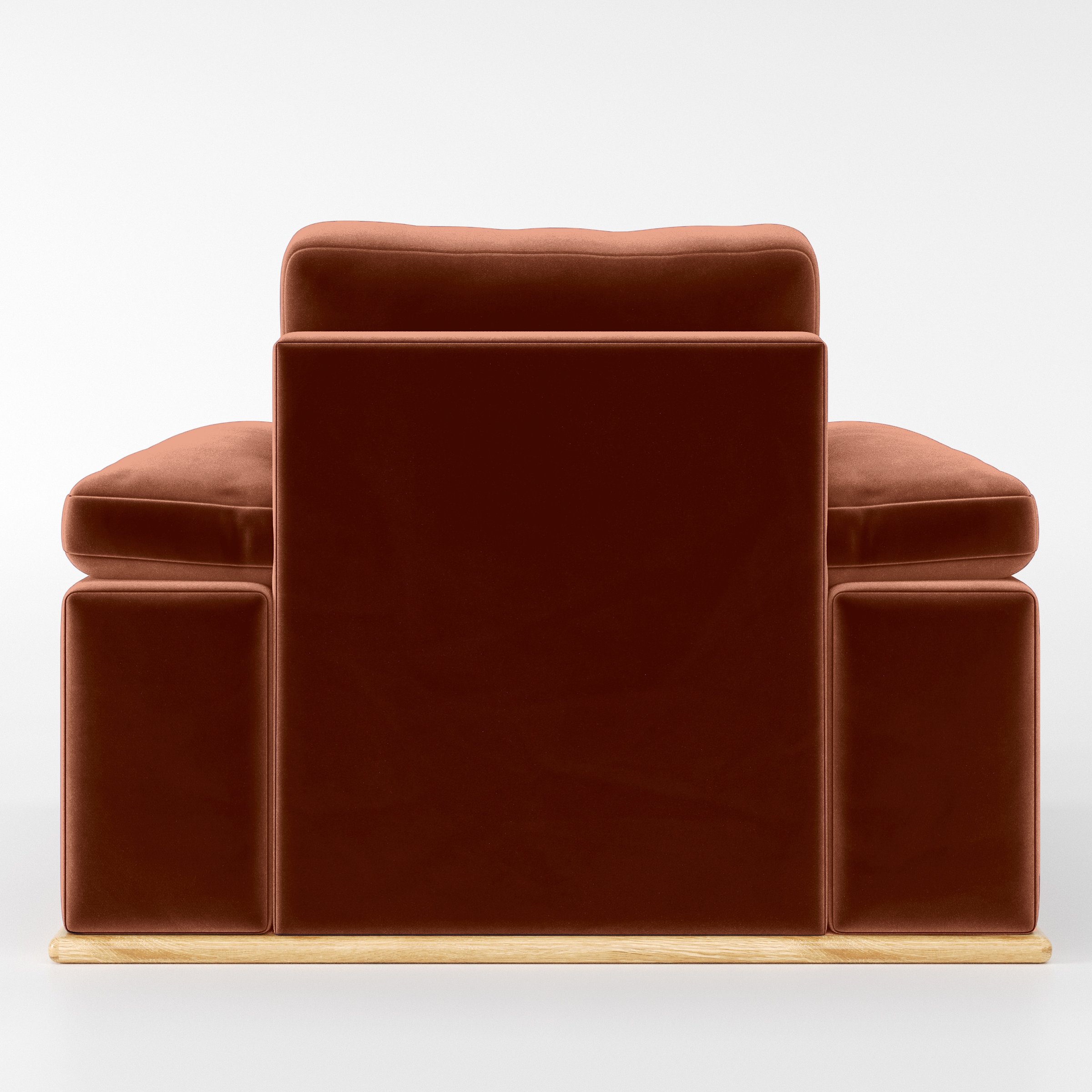 Rear view of the Cusher armchair upholstered in Plush EasyClean Velvet in Apricot.