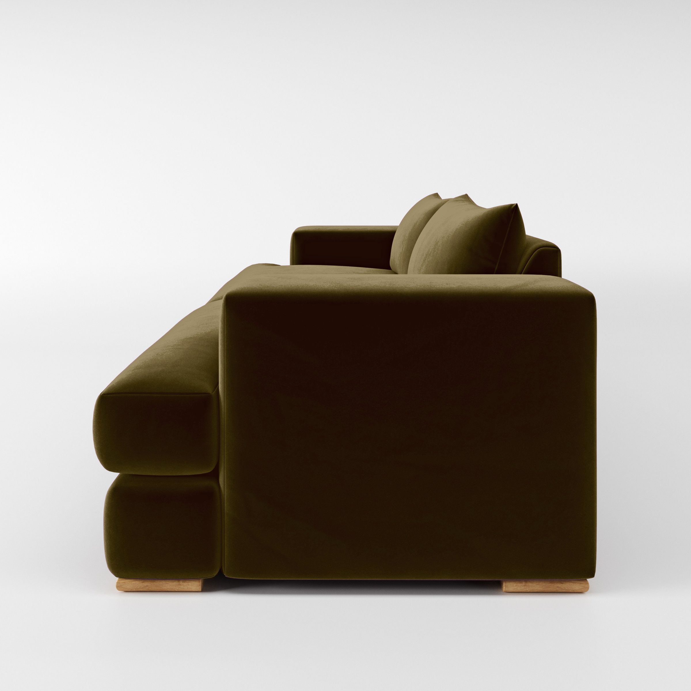 Side view of the Fane sofa upholstered in Plush EasyClean Velvet in Cedar.