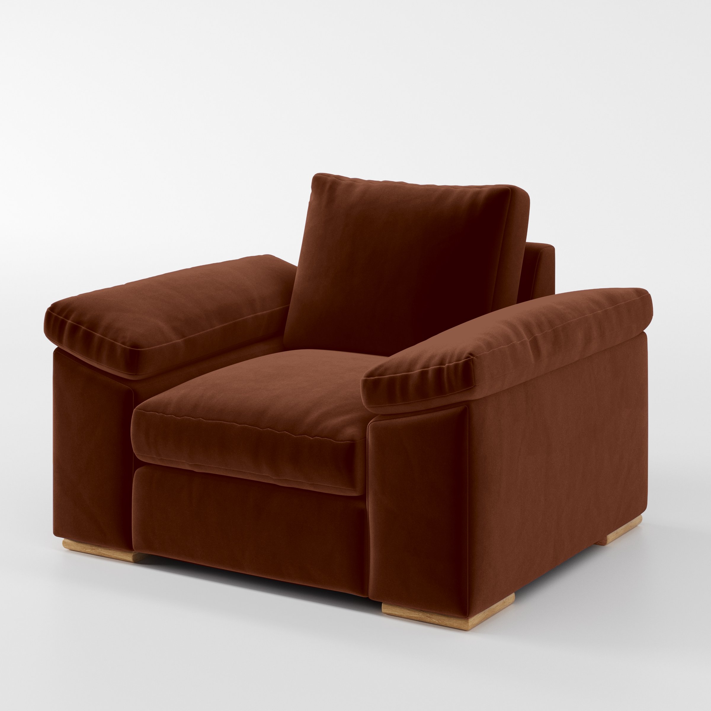 Diagonal view of the Moy armchair upholstered in Plush EasyClean Velvet in Maple.