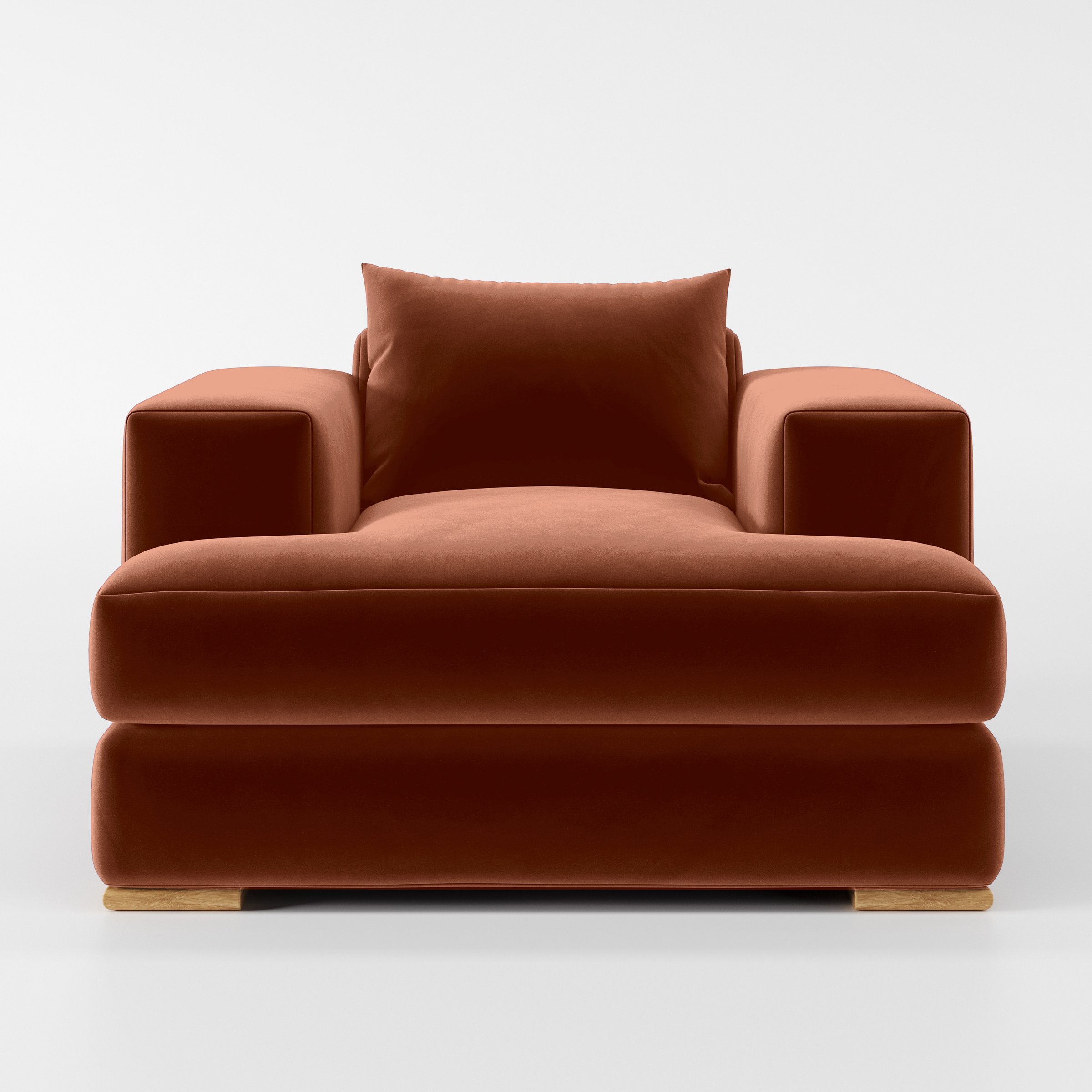 Front view of the Fane armchair upholstered in Plush EasyClean Velvet in Apricot.
