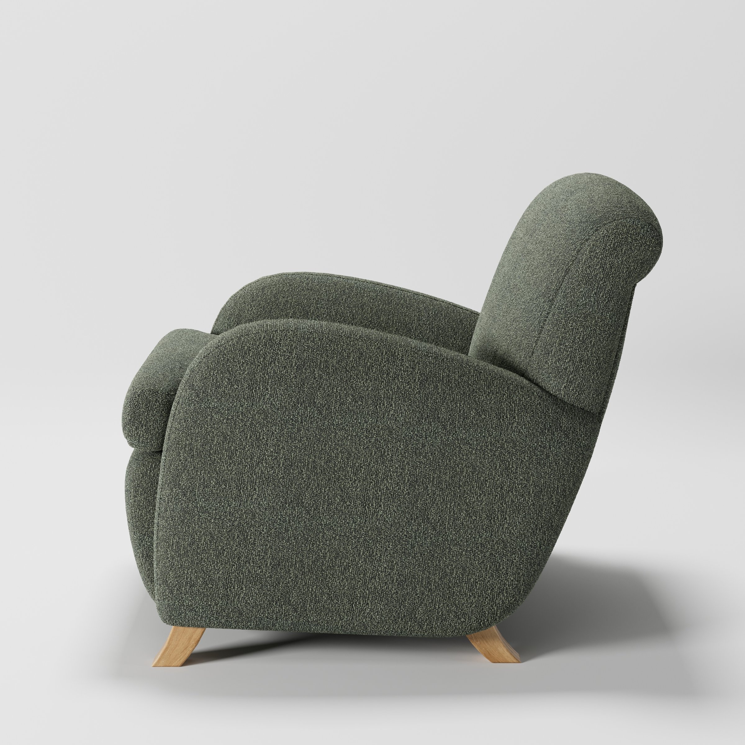 Rye armchair in Kilda Boucle Moss shown in side profile displaying proportions and overall silhouette.