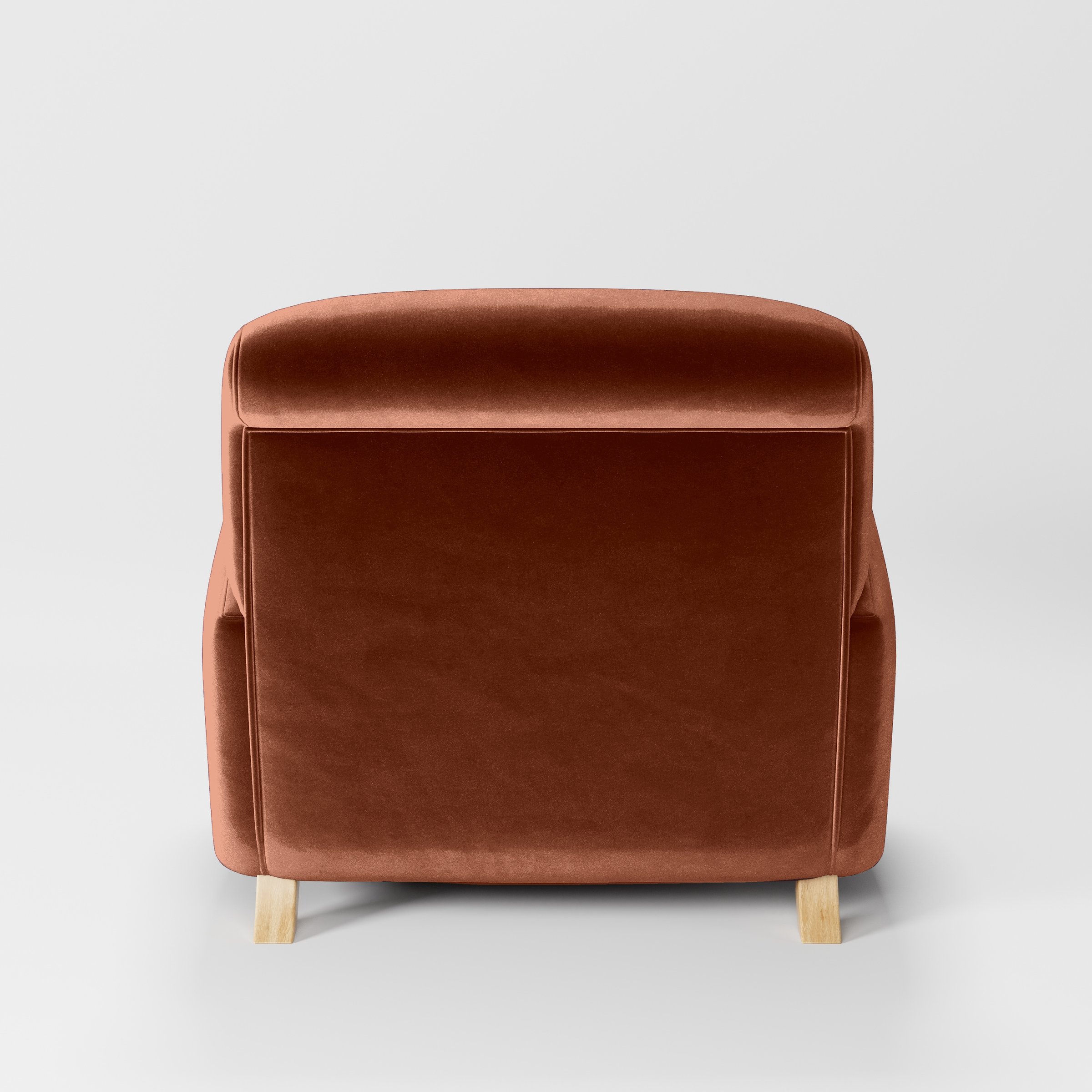 Rear view of the Rye armchair upholstered in Plush EasyClean Velvet in Apricot.