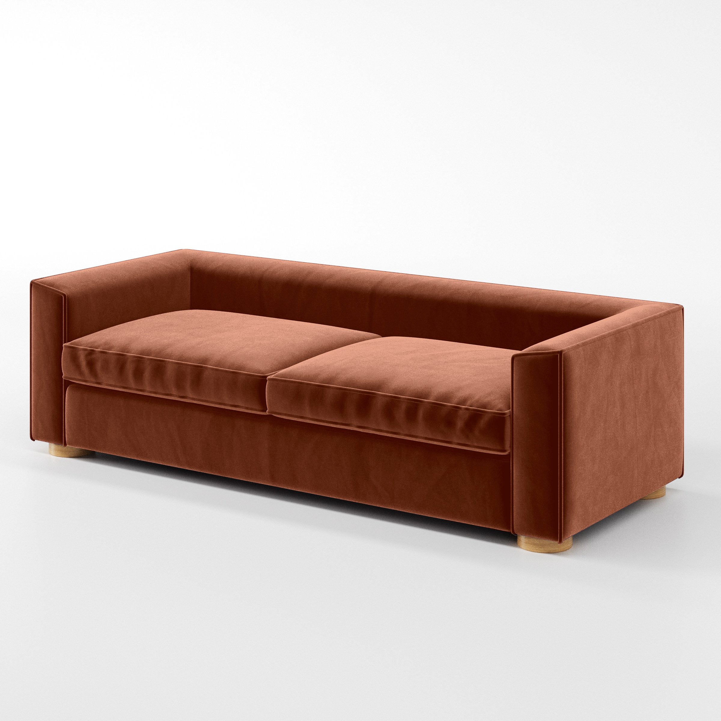 Diagonal view of the Feale sofa upholstered in Plush EasyClean Velvet in Apricot.