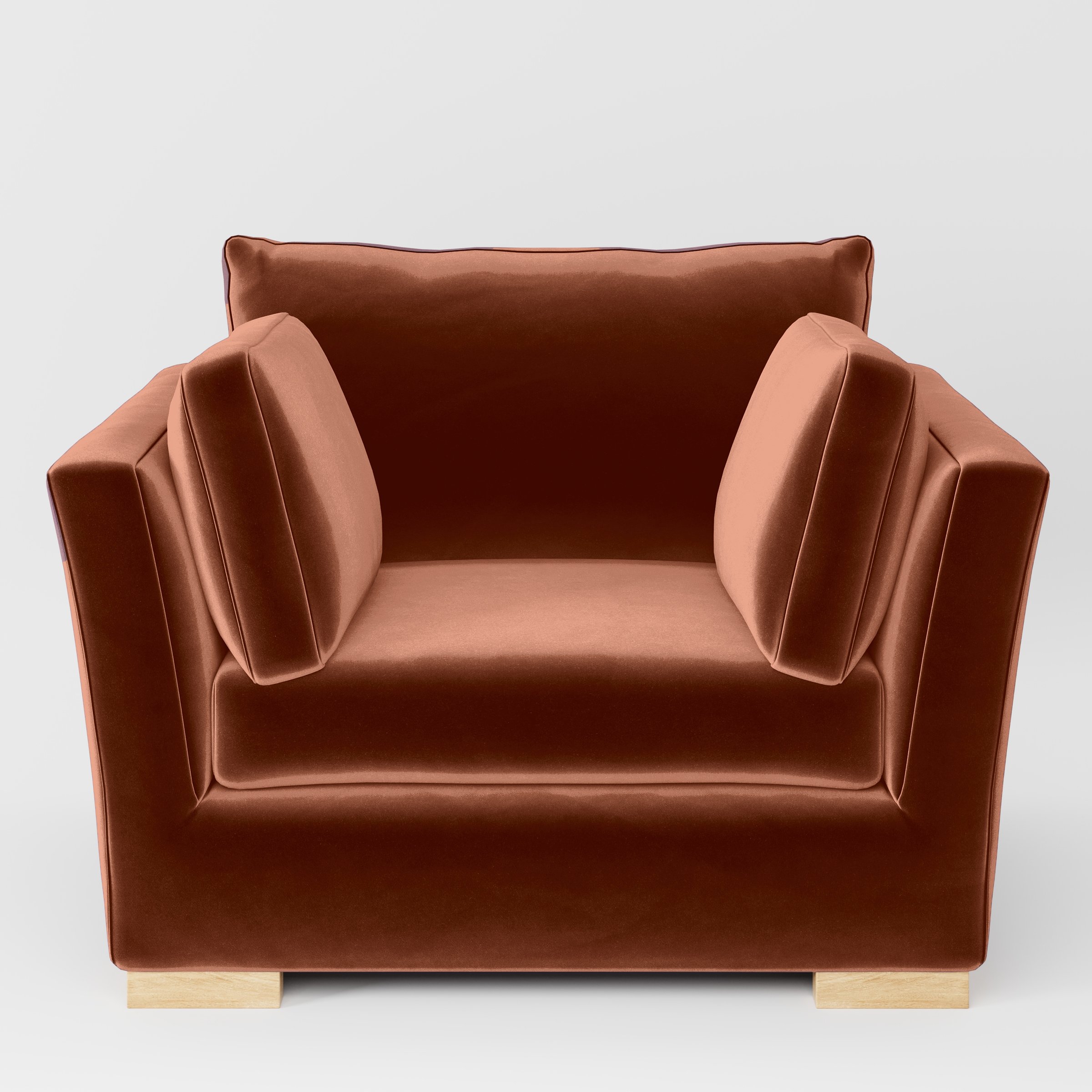 Front view of the Stowe armchair upholstered in Plush EasyClean Velvet in Apricot.