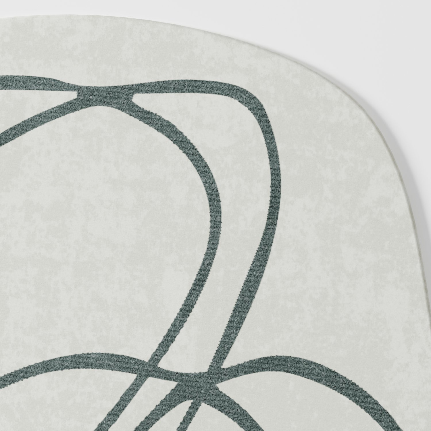 Bann rug in soft cream tone with flowing abstract line pattern in muted green, close-up detail highlighting curved linework and subtle texture, hand tufted wool and viscose blend
