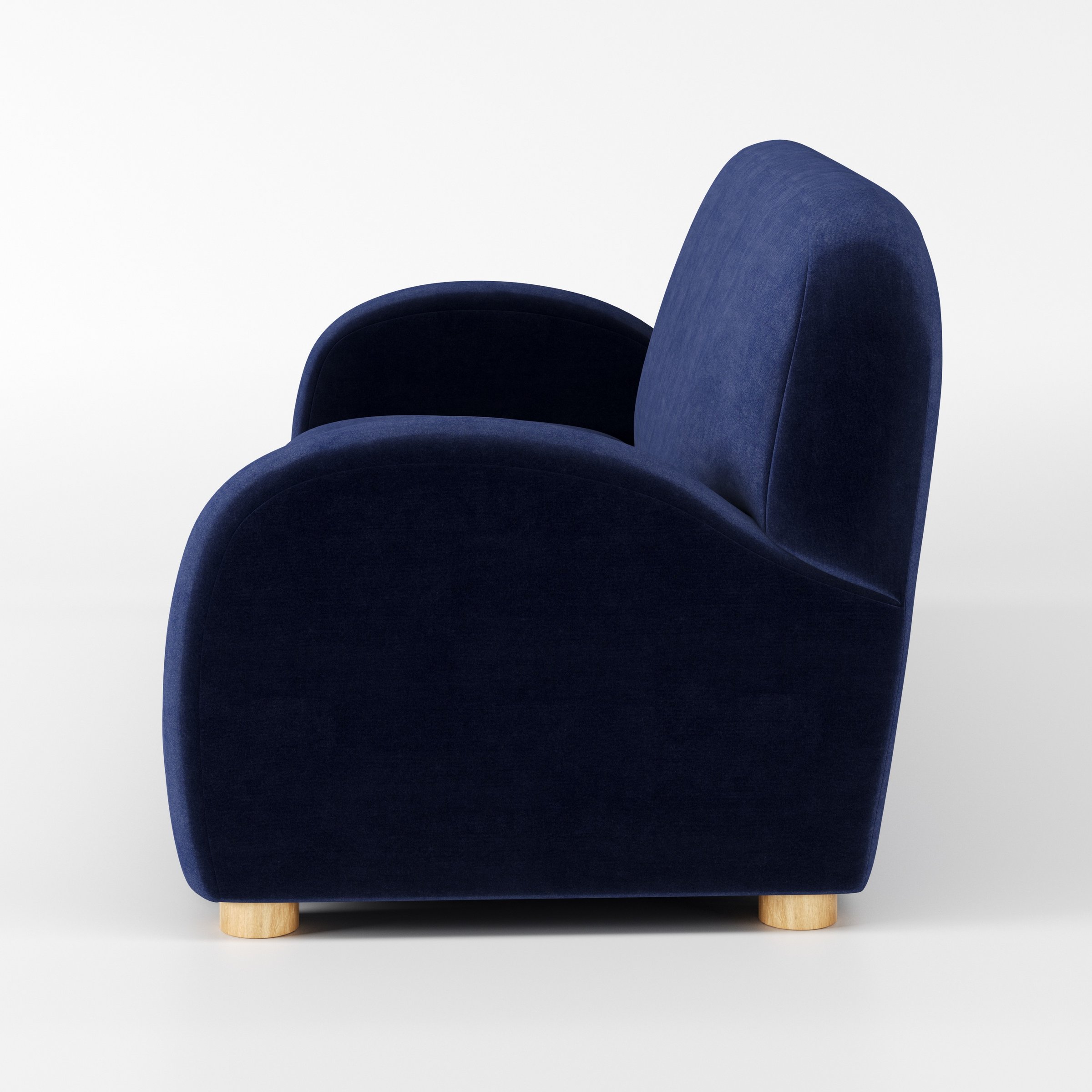 Awe sofa in Noss Velvet Navy shown in side profile displaying proportions and overall silhouette.