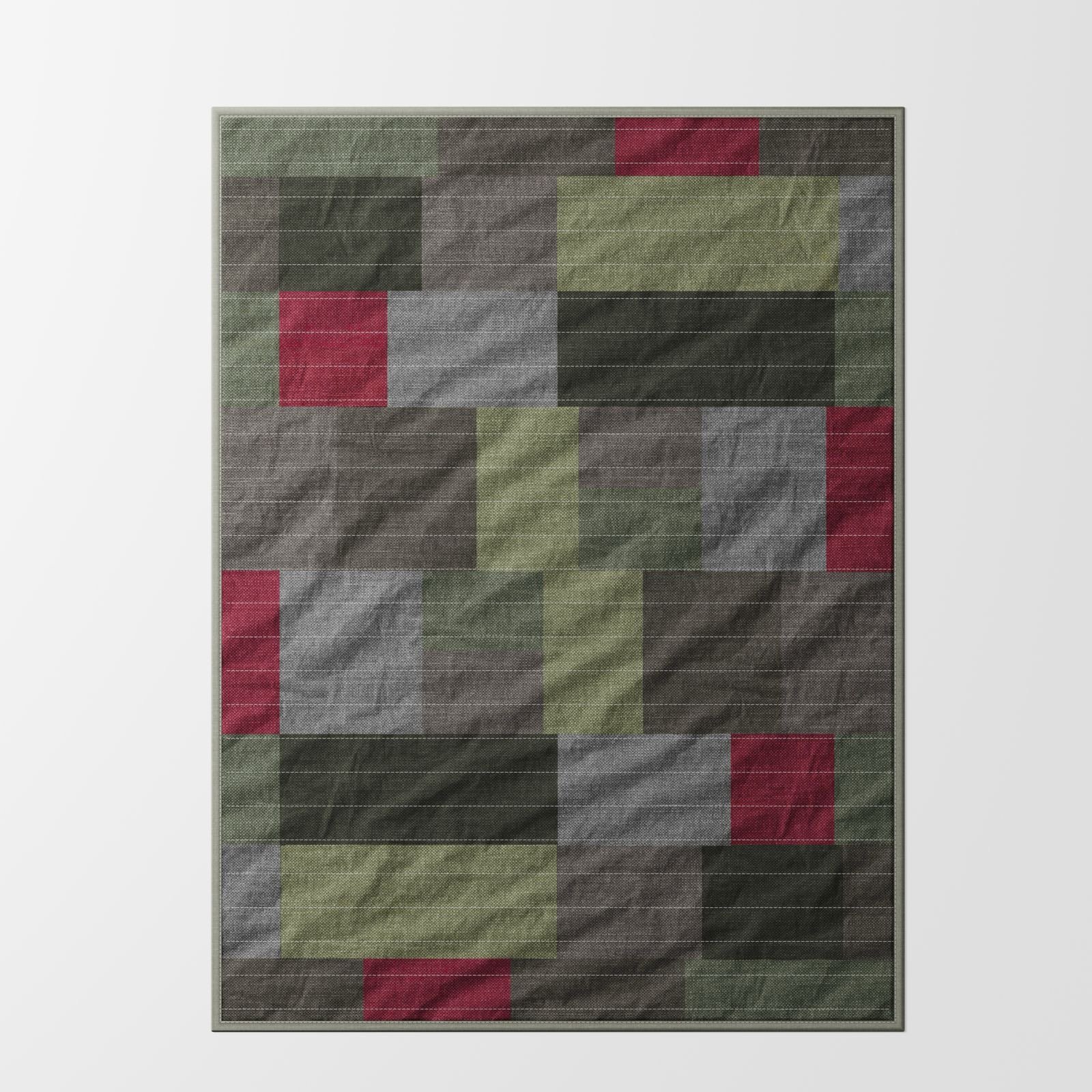 Foxlow patchwork quilt in earthy green, olive, grey and muted red tones, full view showing geometric panel design with stitched linen and cotton construction