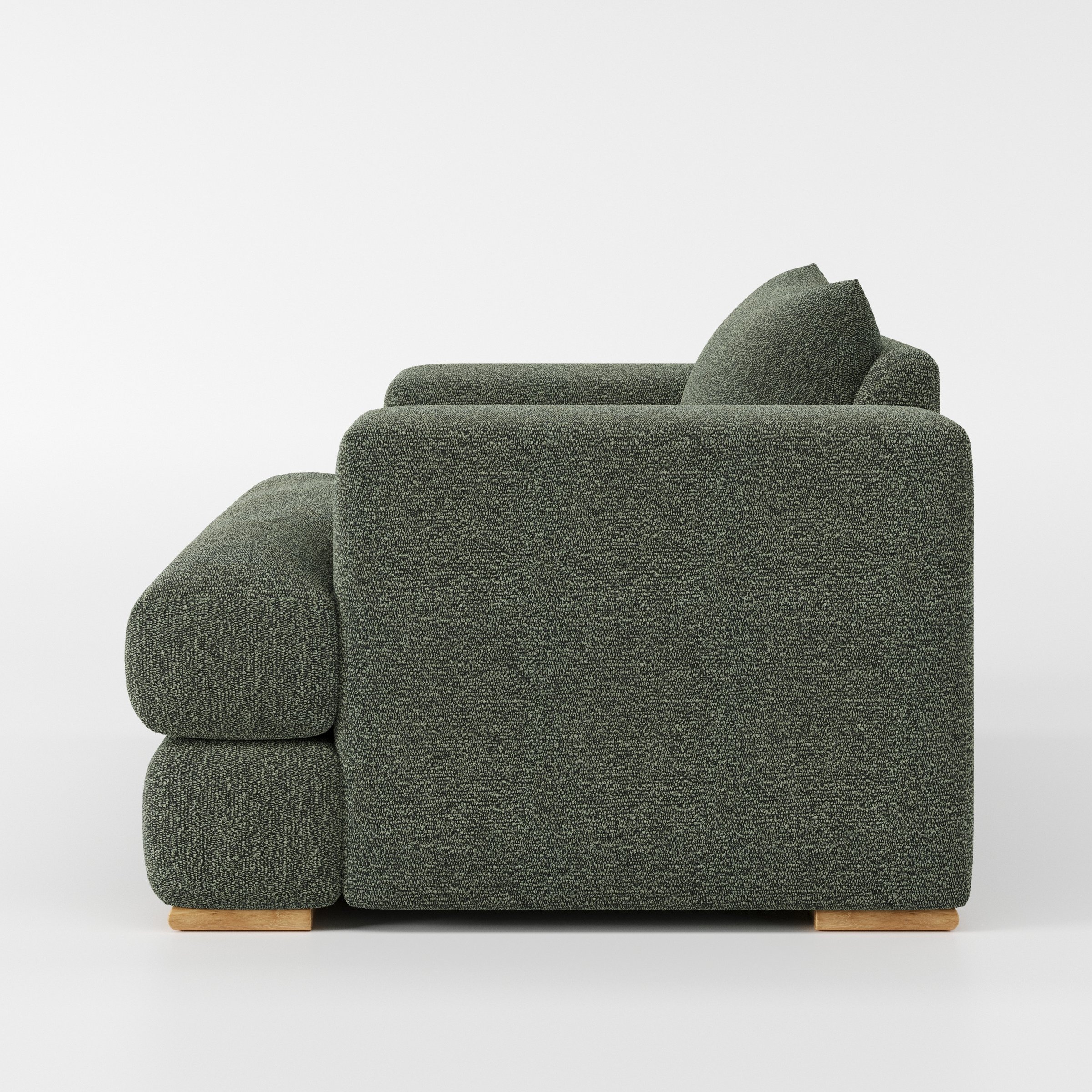 Fane armchair in Kilda Boucle Moss shown in side profile displaying proportions and overall silhouette.