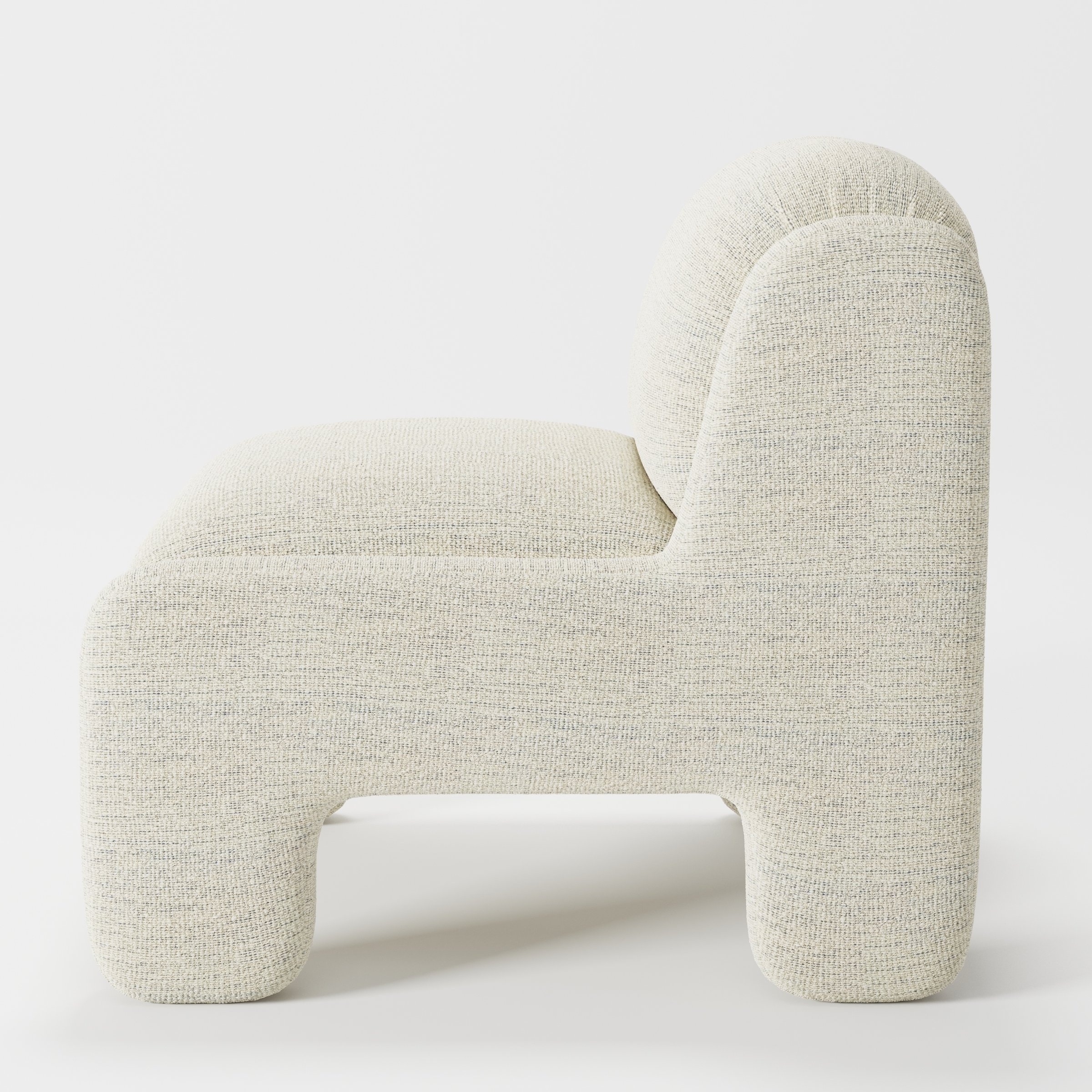 Inny armchair in Orsay Boucle Cream and Marine shown in side profile displaying proportions and overall silhouette.