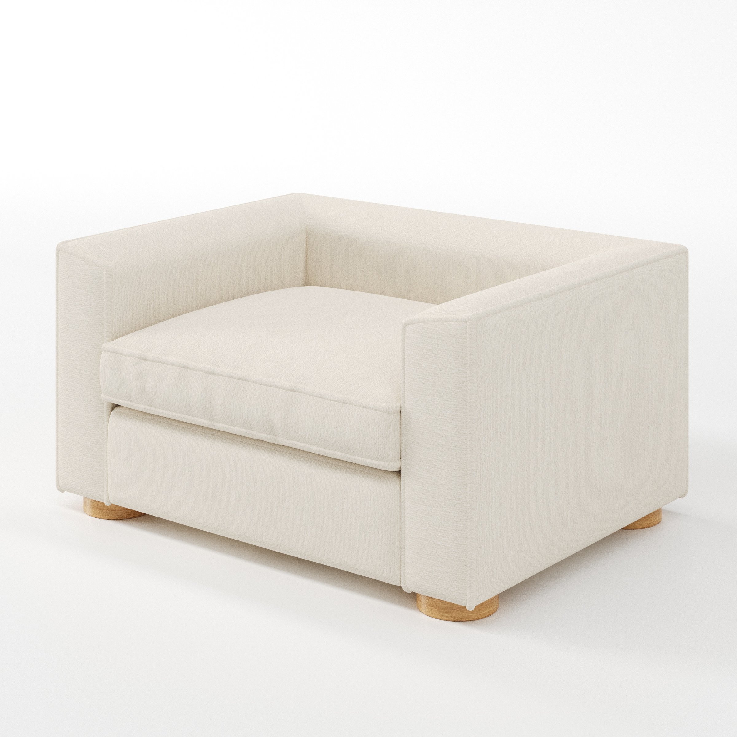 Feale armchair in Kilda Boucle Cream shown at a diagonal angle highlighting arms and seat depth.