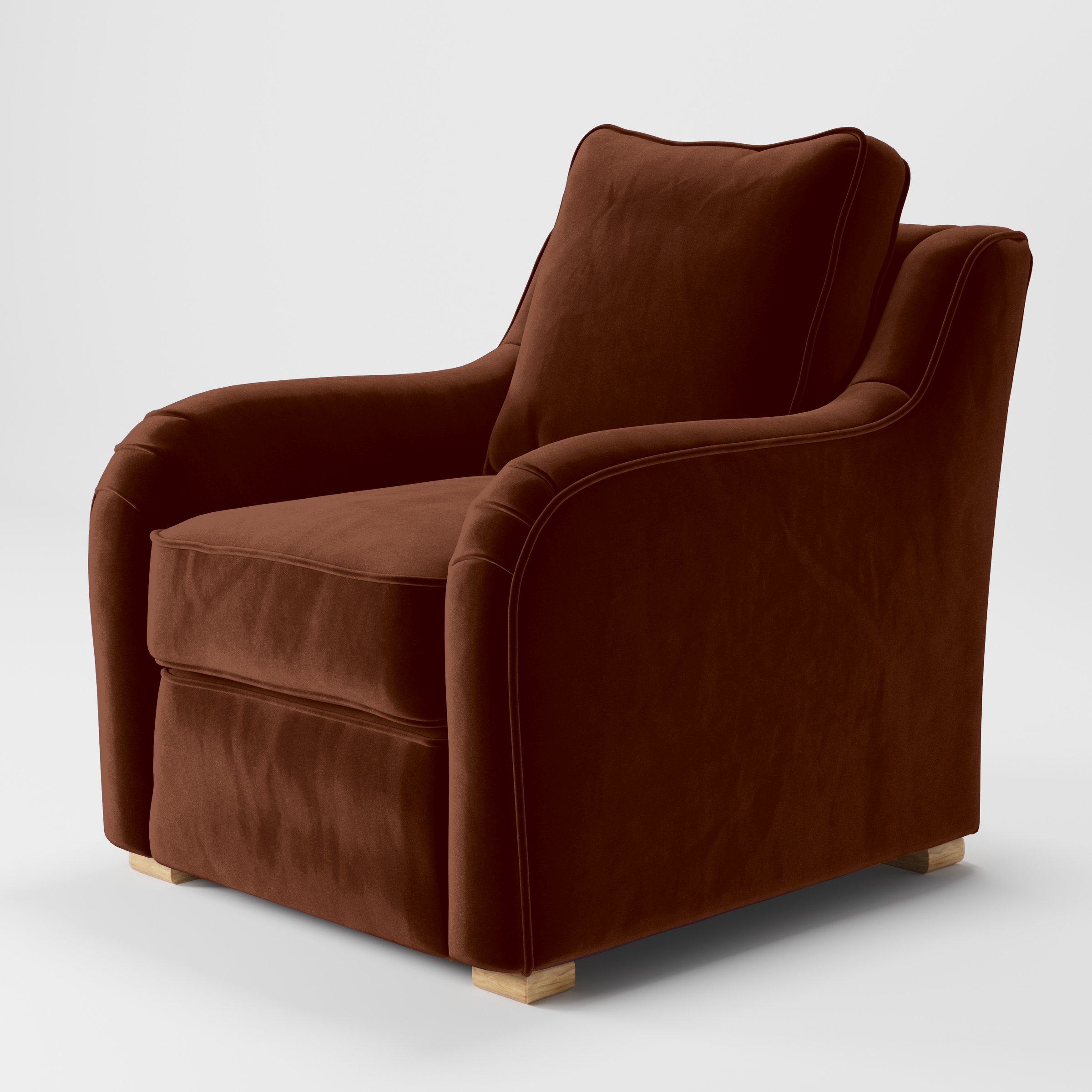 Diagonal view of the Cashel armchair upholstered in Plush EasyClean Velvet in Maple.