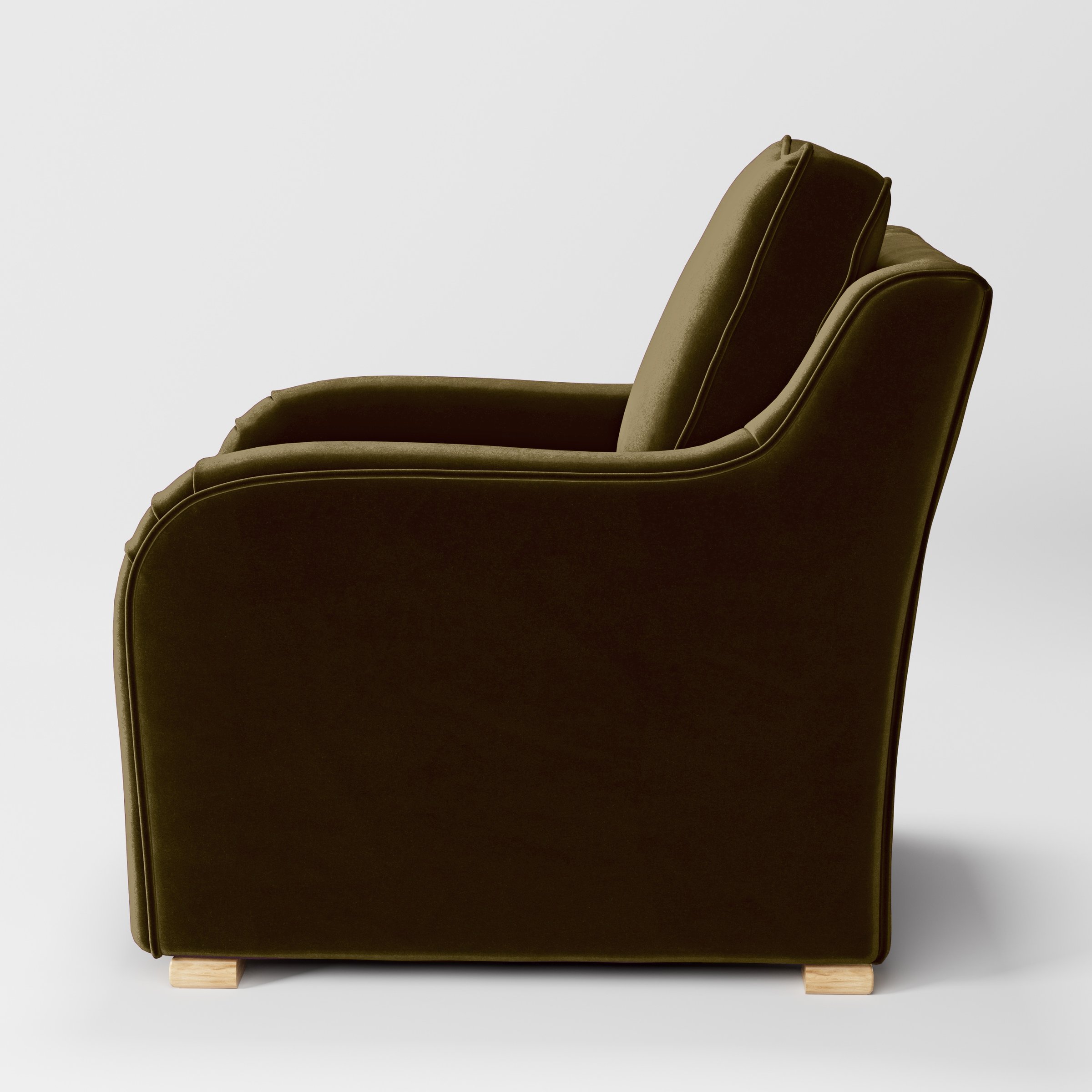 Side view of the Cashel armchair upholstered in Plush EasyClean Velvet in Cedar.