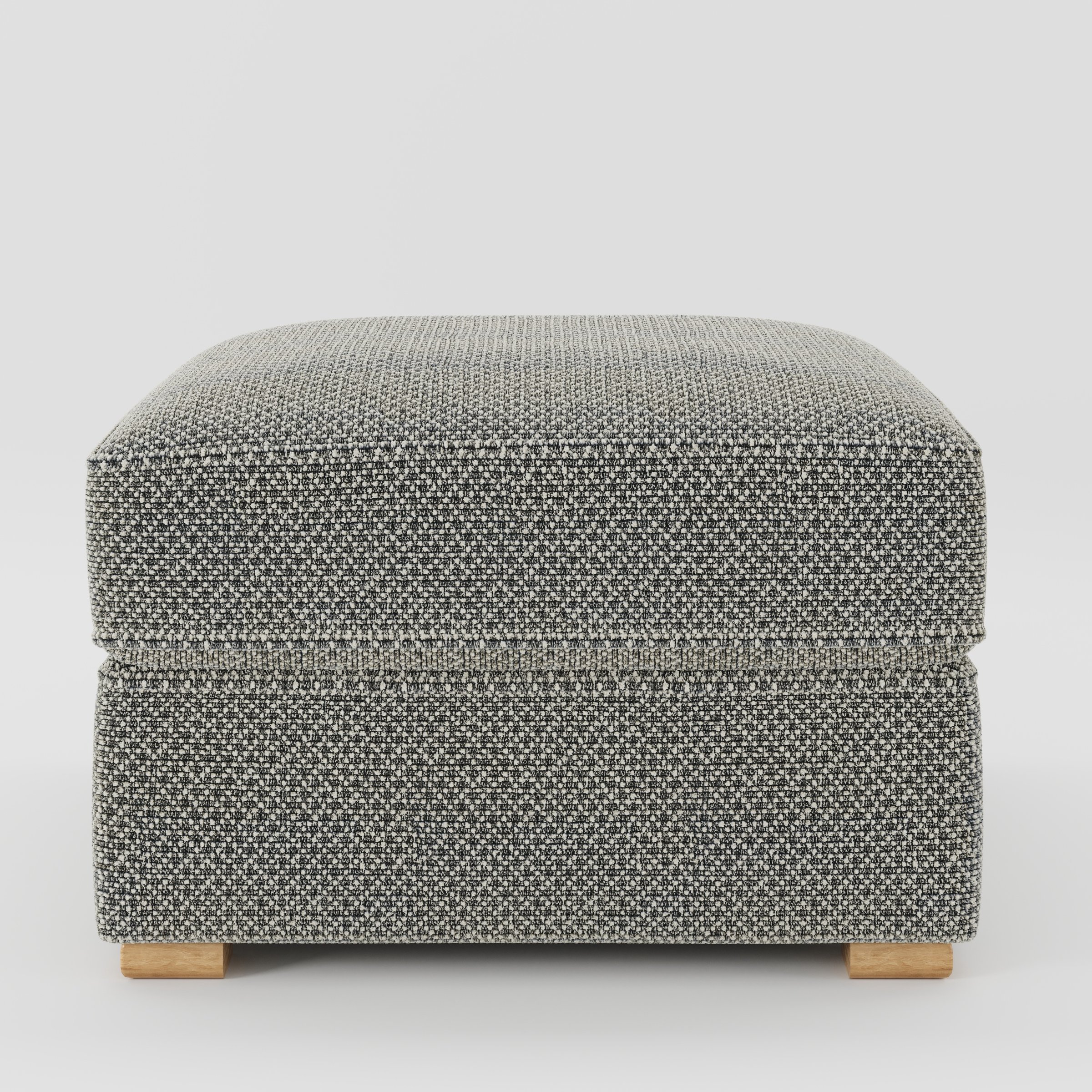 Cashel footstool in Rousay Wool Blend Tar and Chalk shown front-on against a neutral studio backdrop.