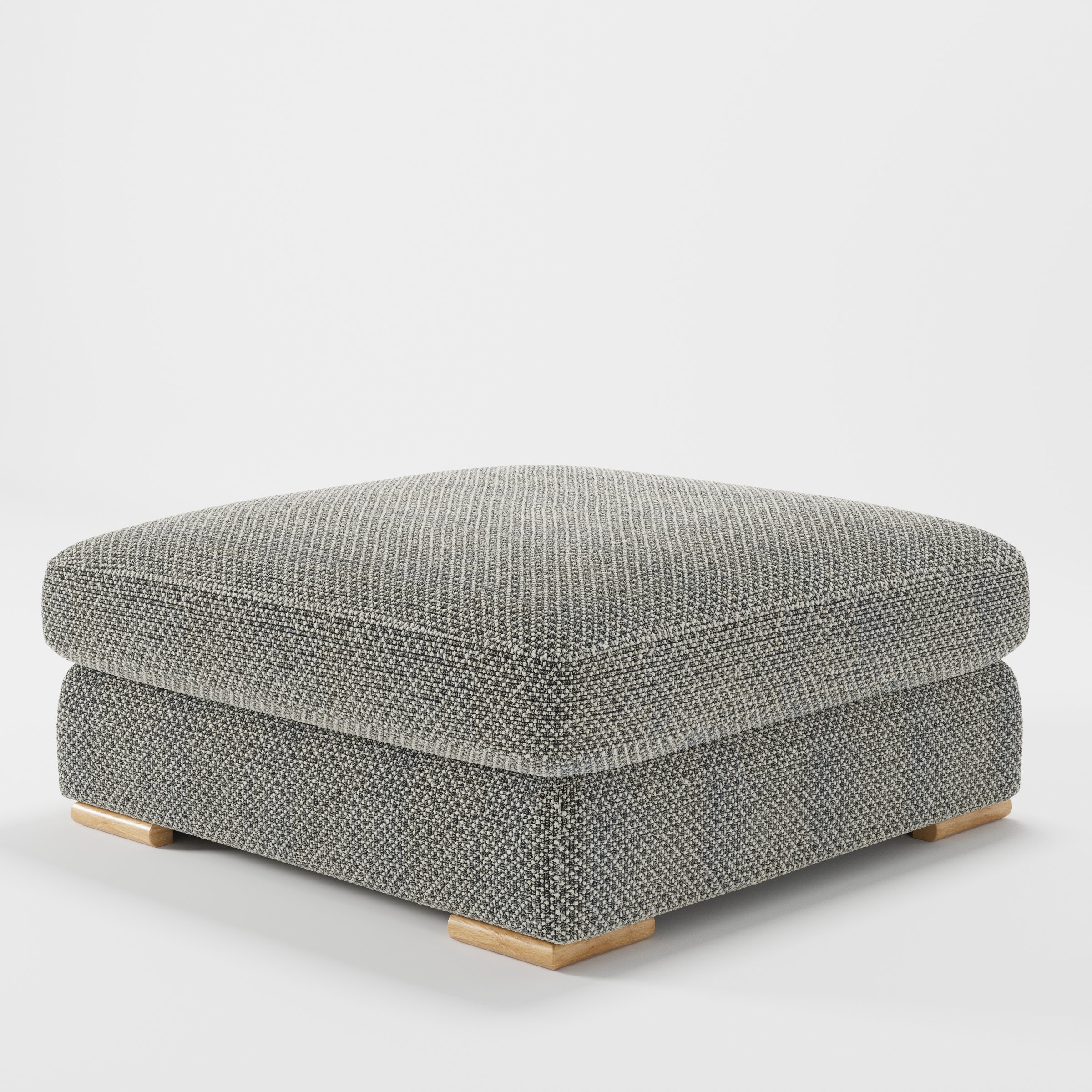 Olton footstool in Rousay Wool Blend Tar and Chalk shown at a diagonal angle highlighting low profile and inset wooden base.