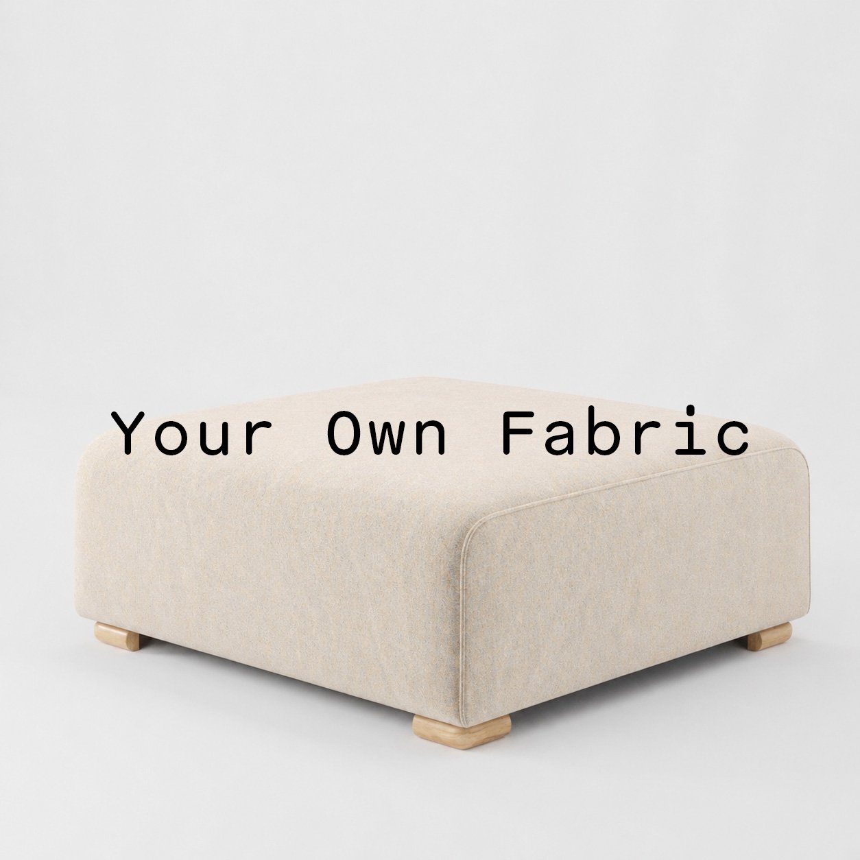 Diagonal view of the Tay footstool upholstered in customers own material calico cotton fabric.