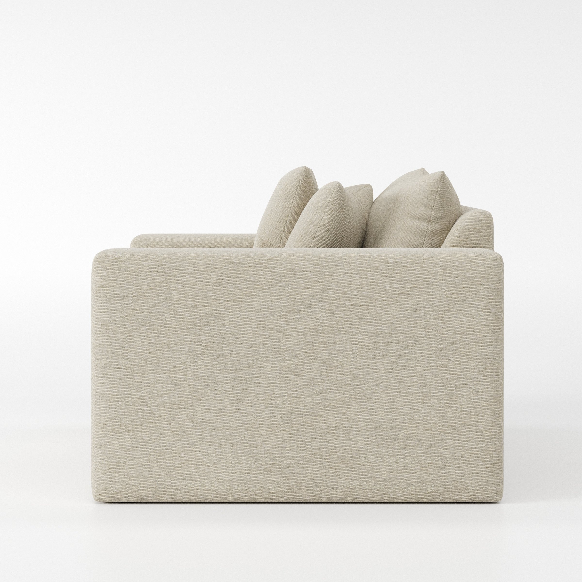 Coniston armchair in Alderney Linen Oatmeal shown in side profile displaying proportions and overall silhouette.