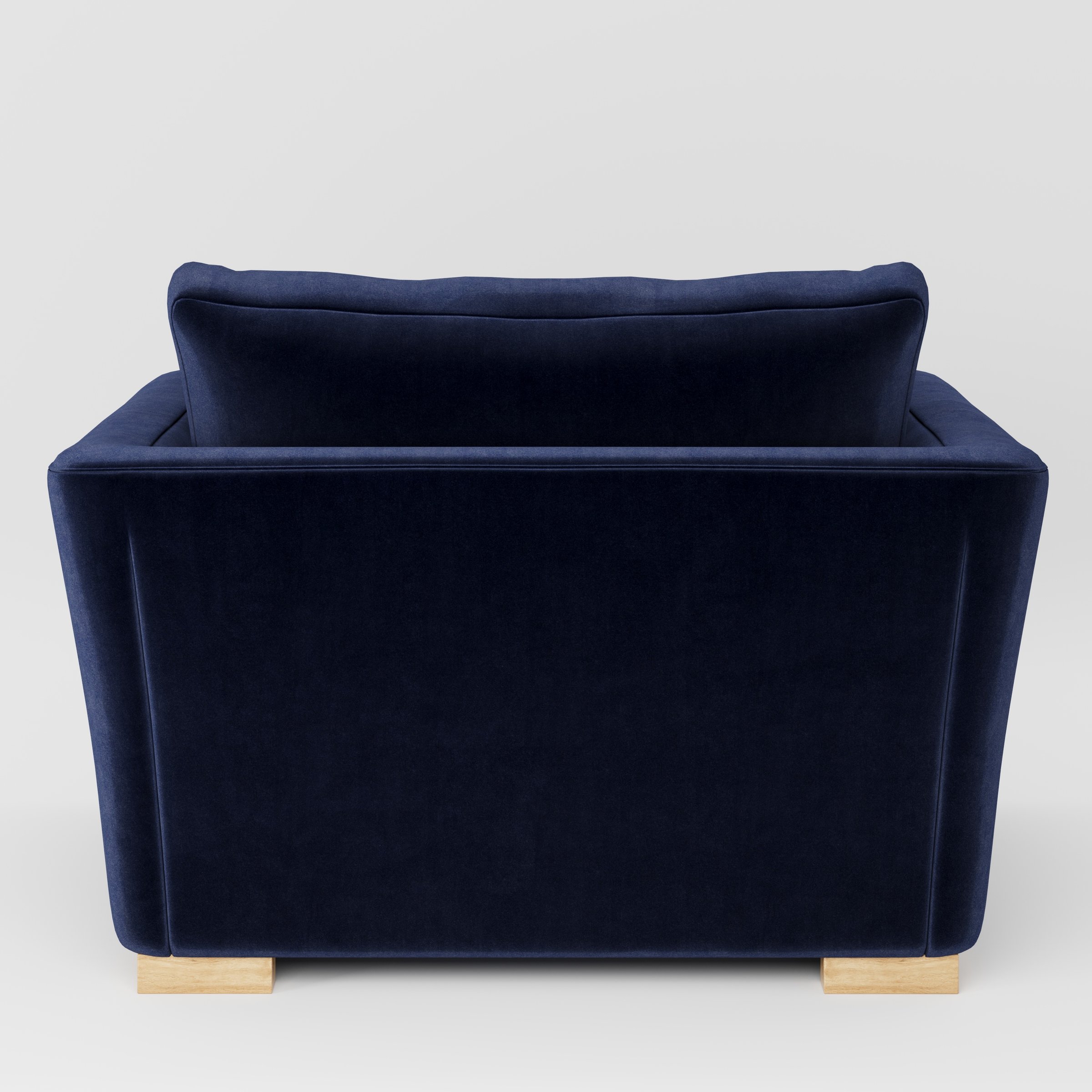 Stowe armchair in Noss Velvet Navy shown from the rear highlighting backrest shape and upholstery finish.