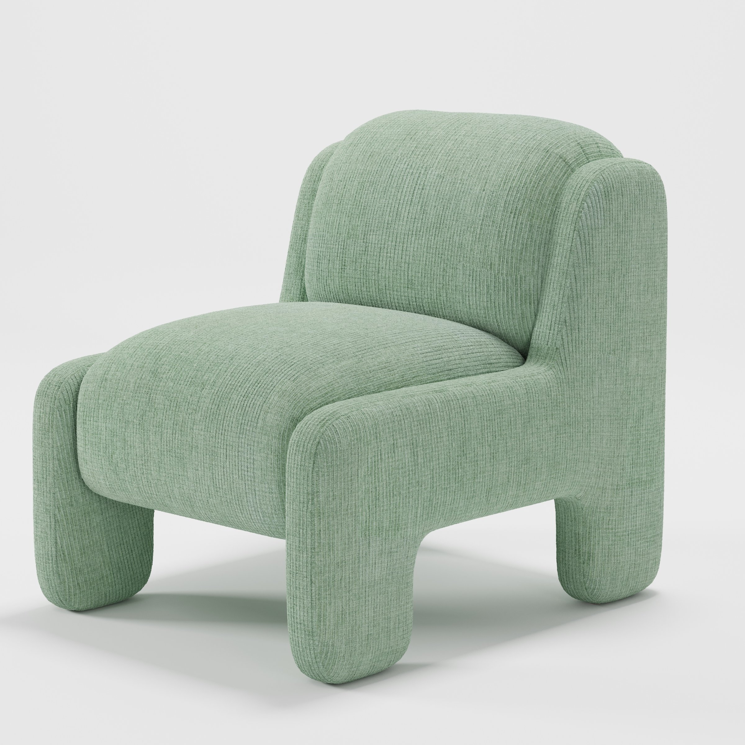 Inny armchair in Caldey Velvet Corduroy Eucalyptus shown at a diagonal angle highlighting sculpted form and low seat.