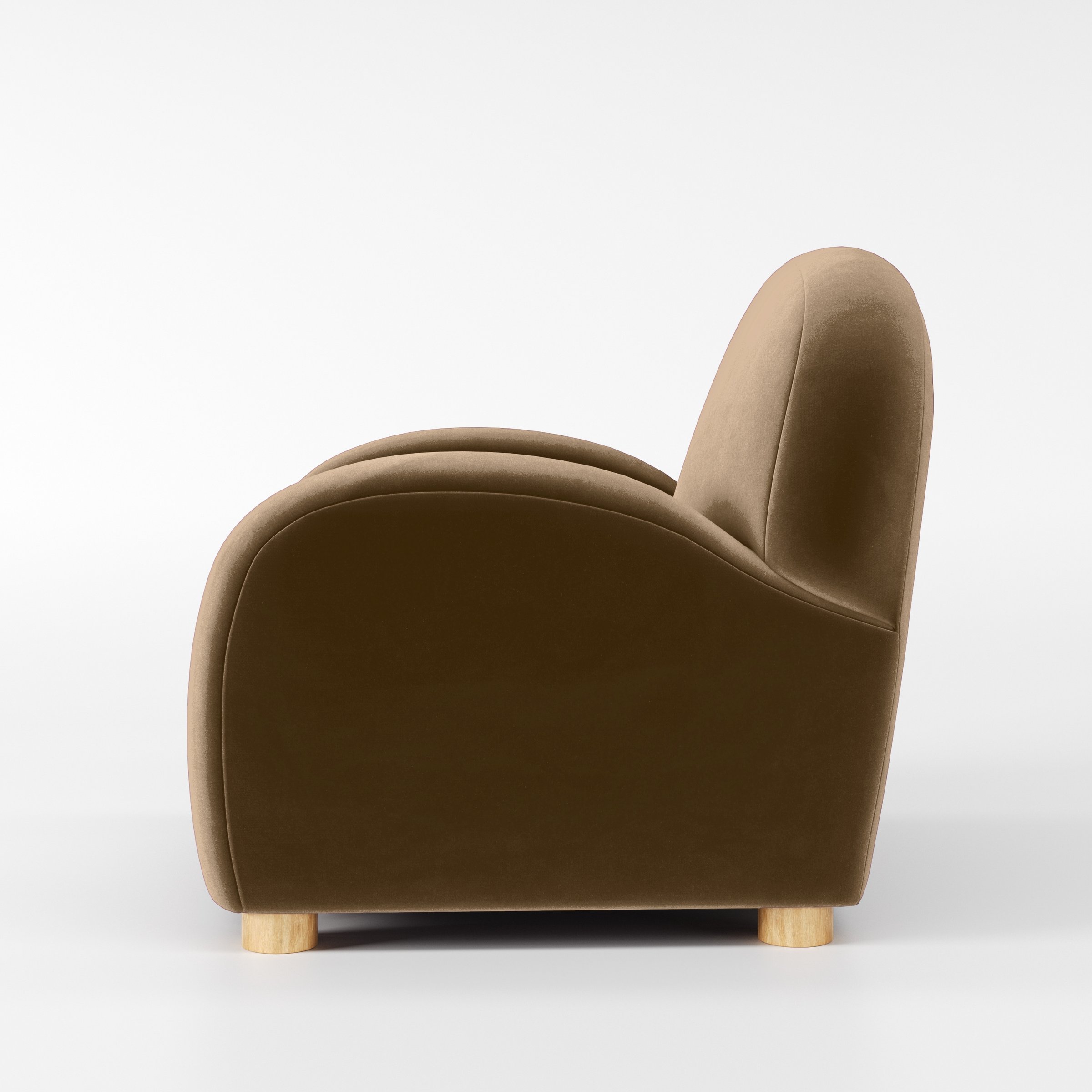 Side view of the Awe armchair upholstered in Plush EasyClean Velvet in Caribou.
