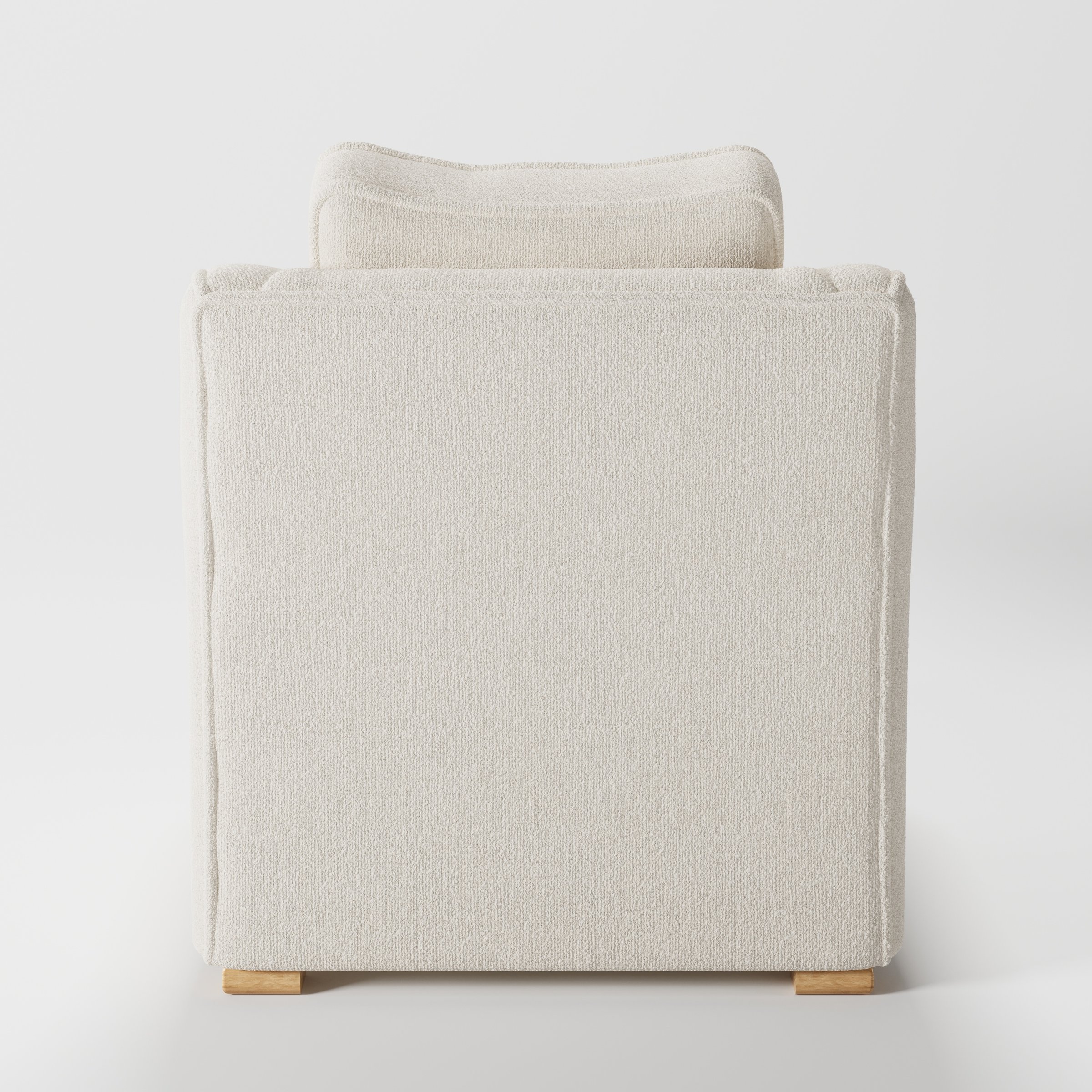 Cashel armchair in Kilda Boucle Cream shown from the rear highlighting backrest shape and upholstery finish.