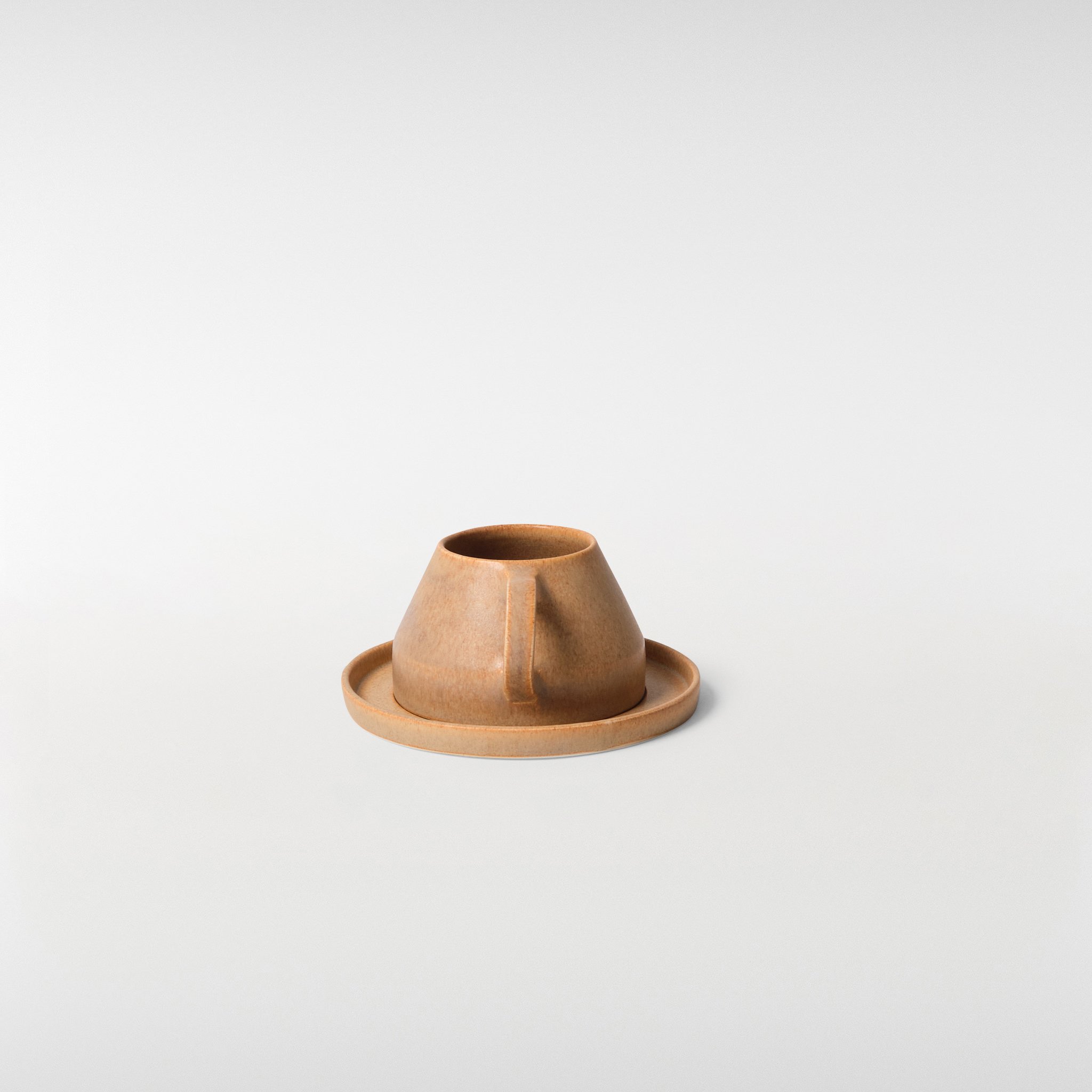 Chamfer Honey glazed ceramic cup and saucer set, rear angle showing geometric form, handle shape and consistent glaze finish