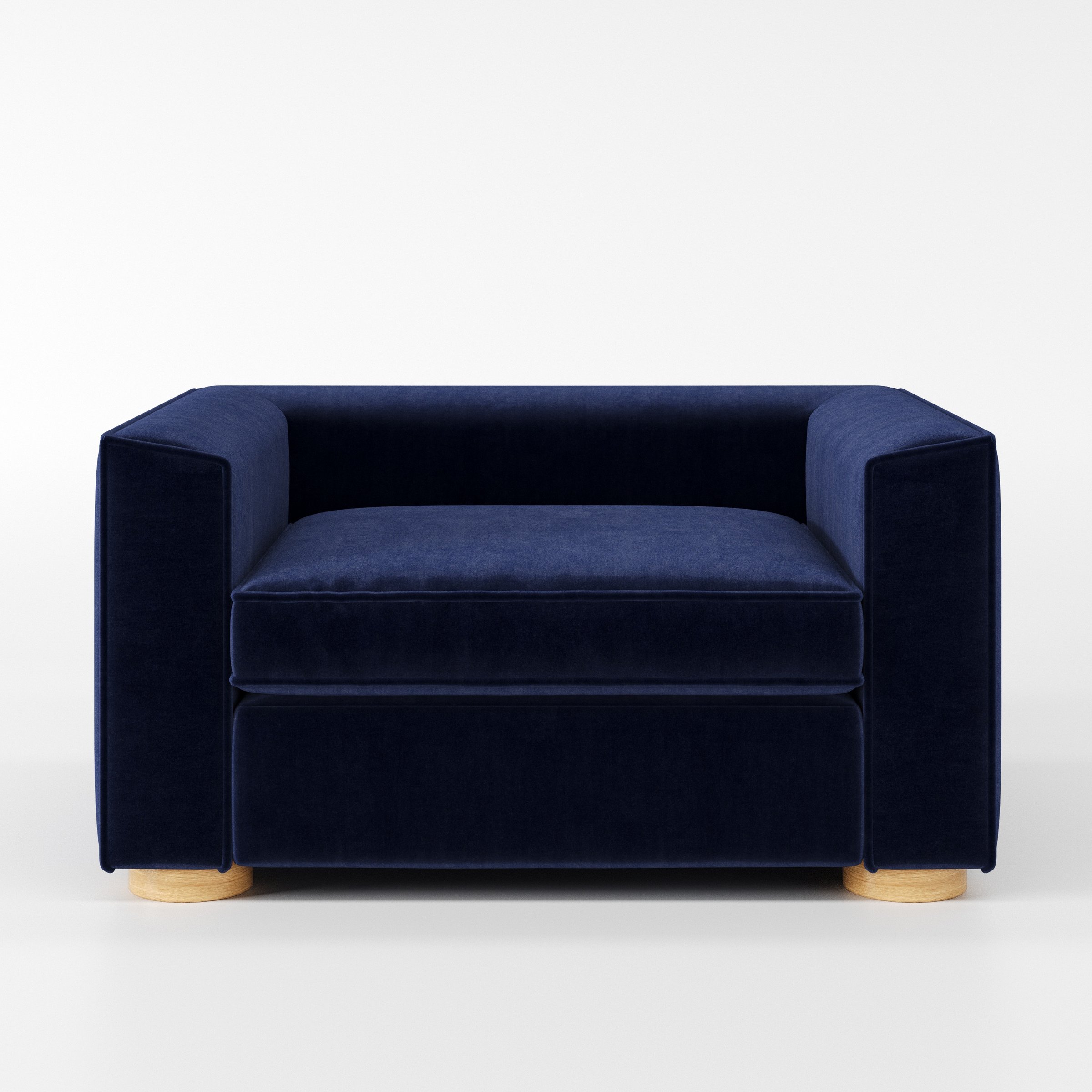 Feale armchair in Noss Velvet Navy shown front-on against a neutral studio backdrop.