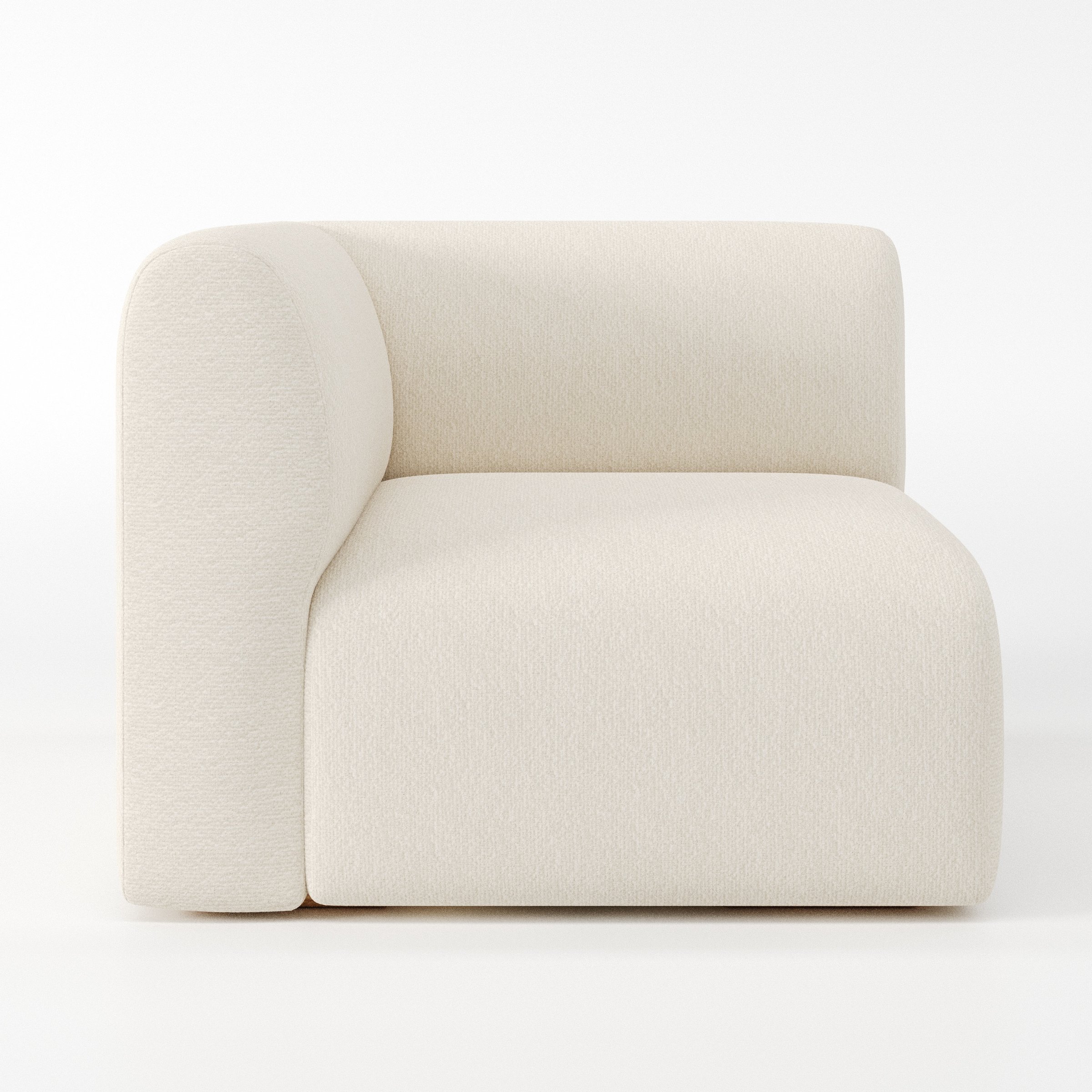 Drumquin modular sofa corner unit in Kilda Bouclé Cream shown from the left highlighting the wraparound back and soft, sculpted form.