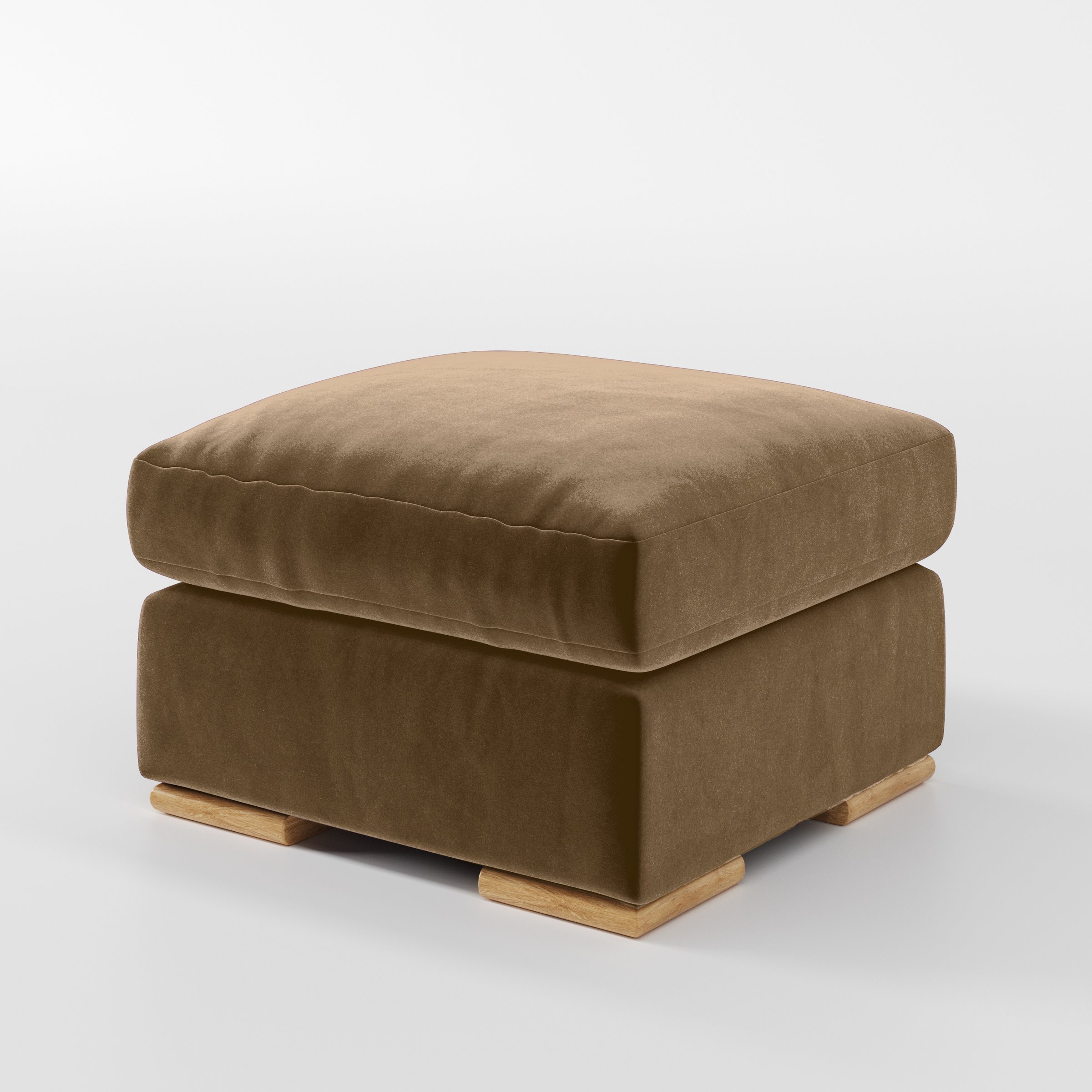 Diagonal view of the Fane footstool upholstered in Plush EasyClean Velvet in Caribou.