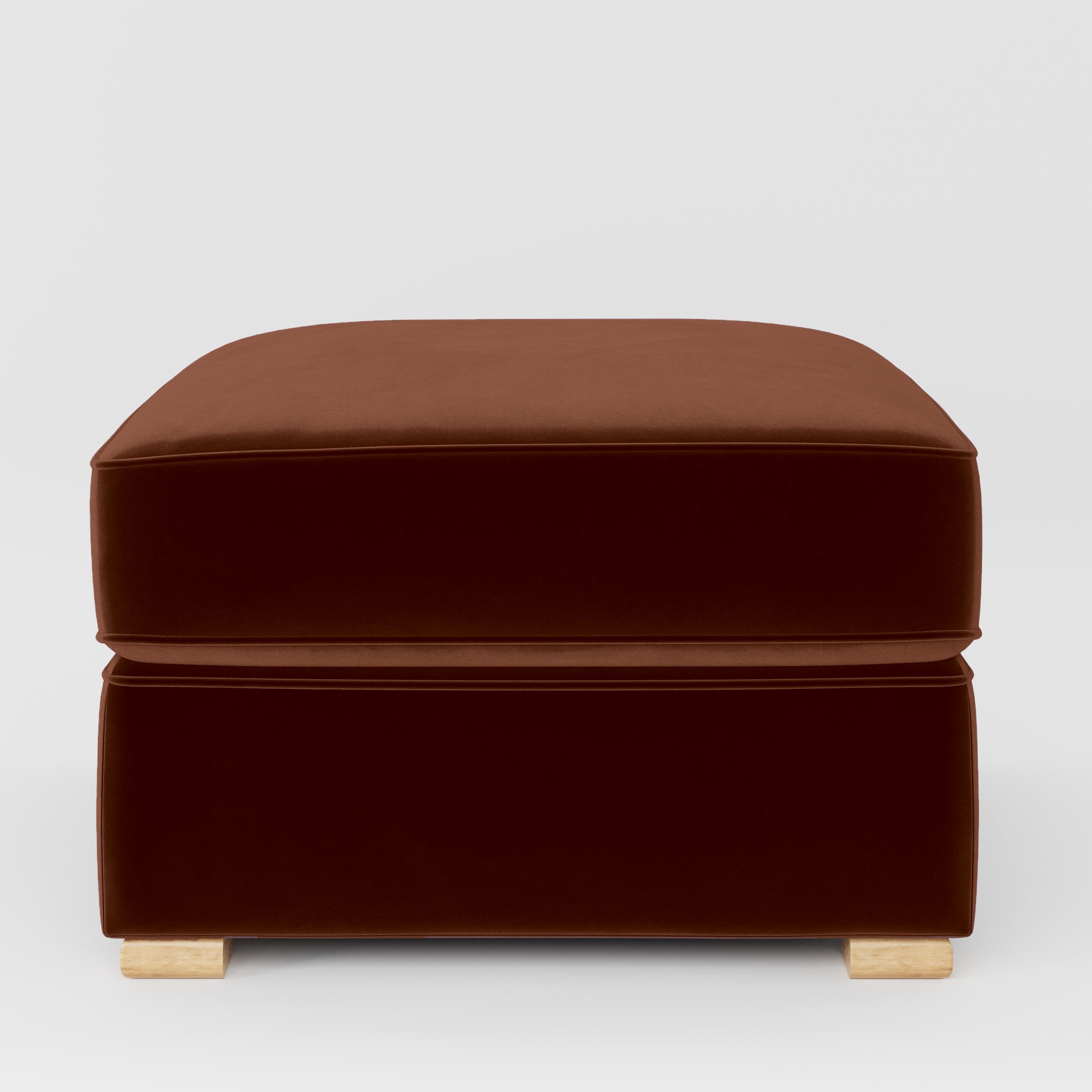 Front view of the Cashel footstool upholstered in Plush EasyClean Velvet in Maple.