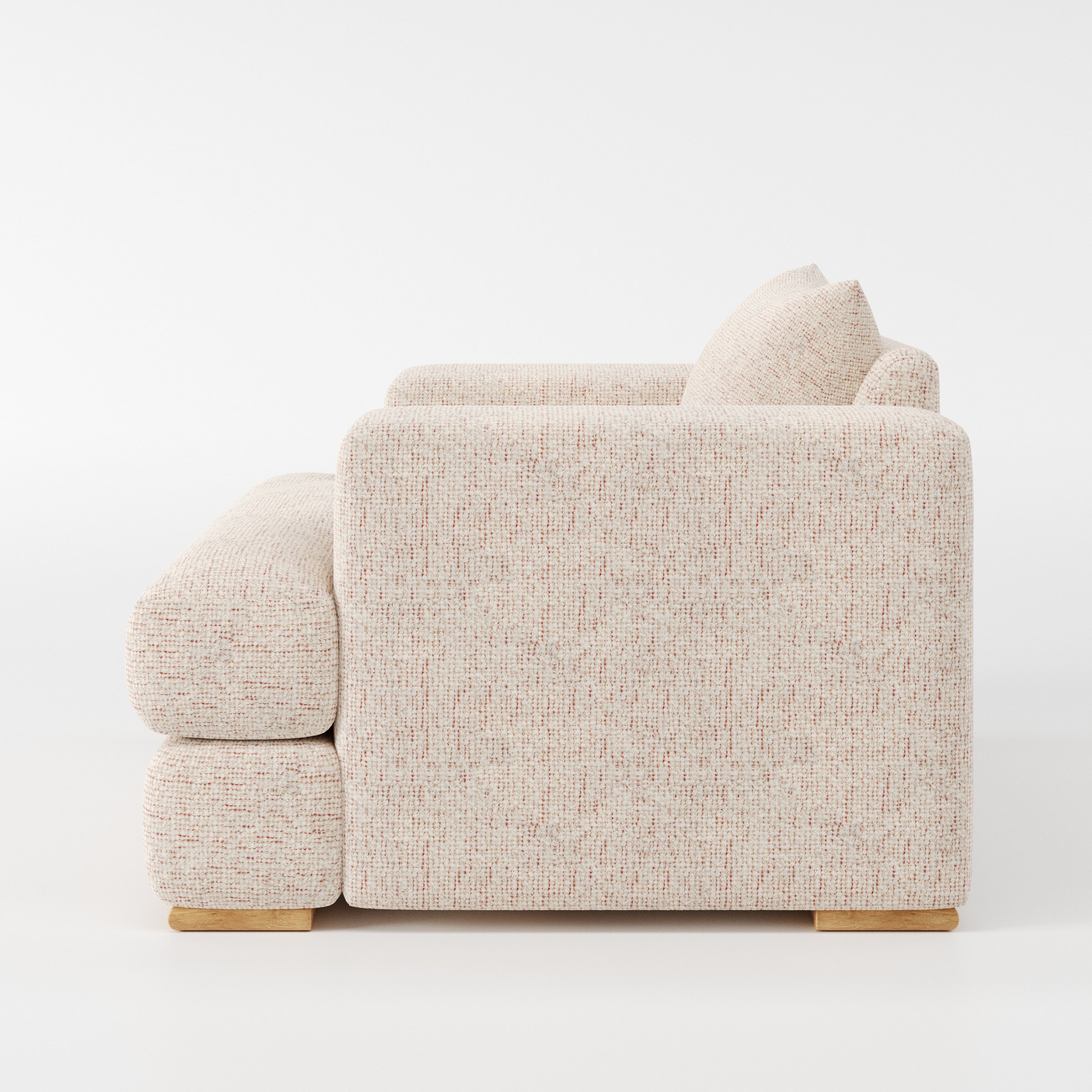Fane armchair in Orsay Boucle Cream and Copper shown in side profile displaying proportions and overall silhouette.