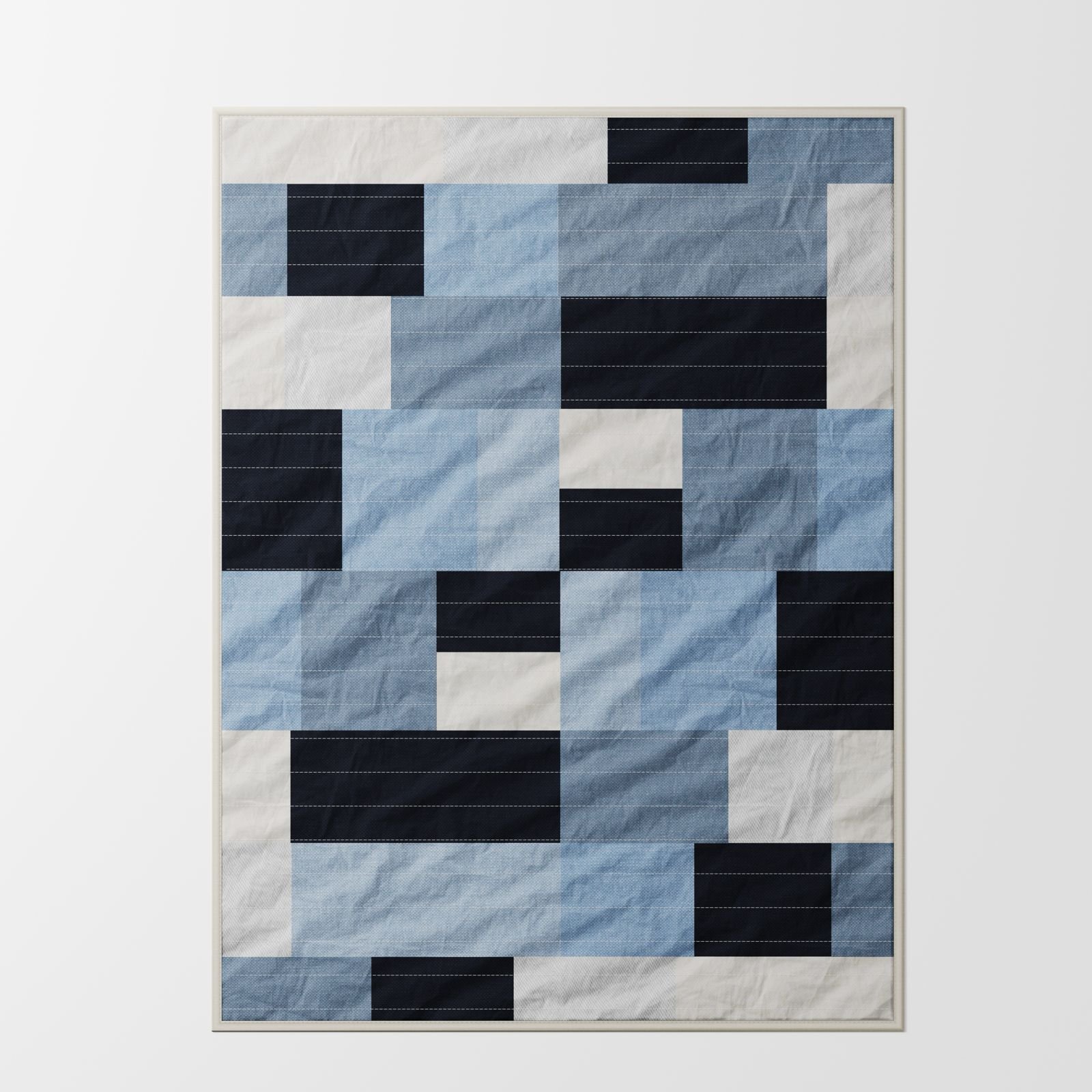 Brant patchwork quilt in soft blue, navy and off-white tones, full view showing geometric patchwork design with stitched panel construction in linen and cotton blend
