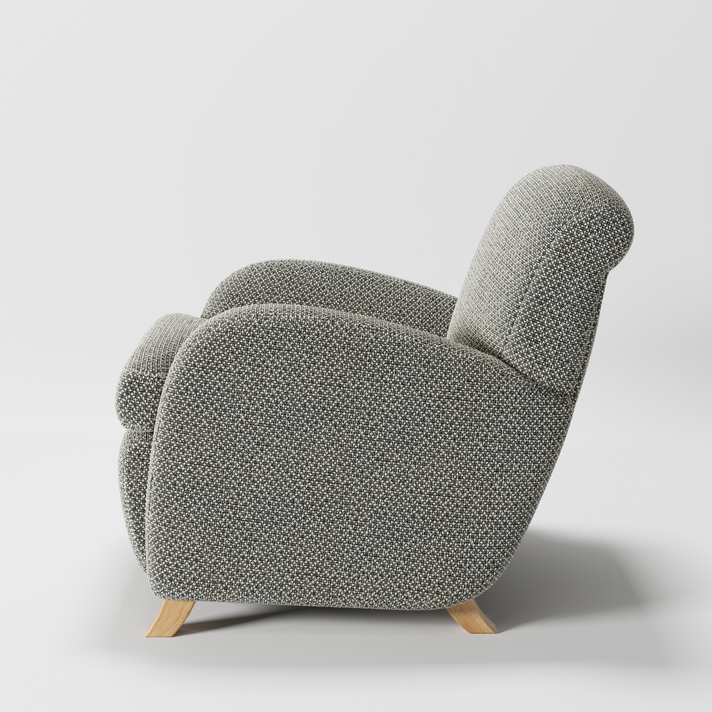 Rye armchair in Rousay Wool Blend Tar and Chalk shown in side profile displaying proportions and overall silhouette.