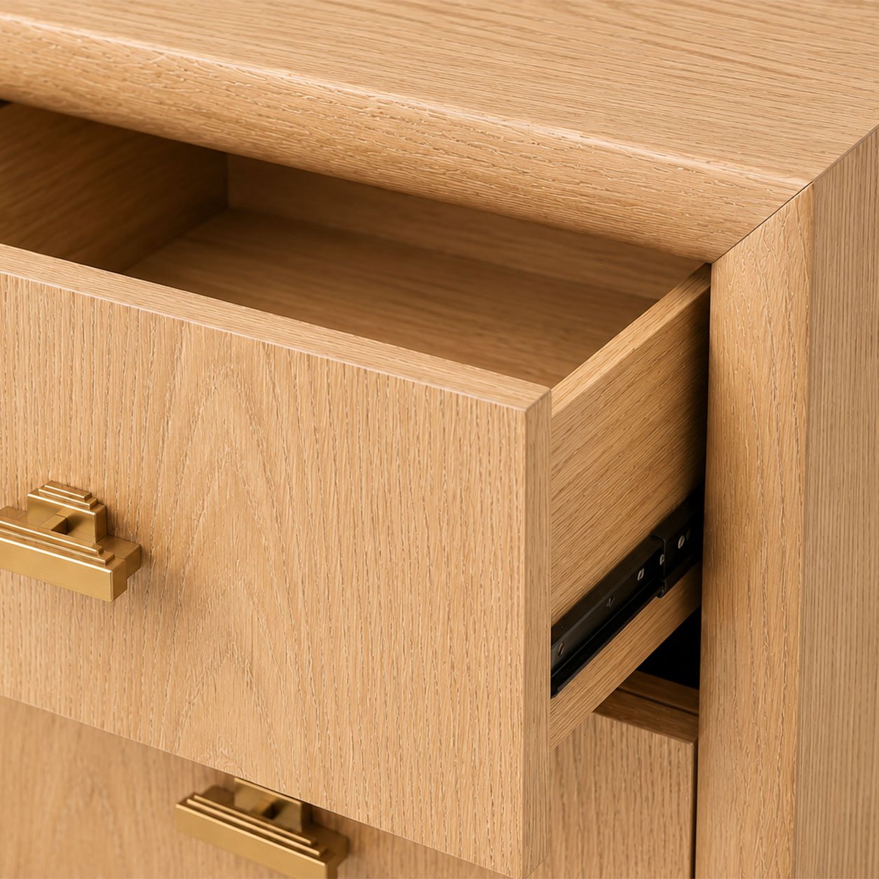 Close-up of Nightstand 02 in natural oak showing the open drawer, brass handle and oak grain detail