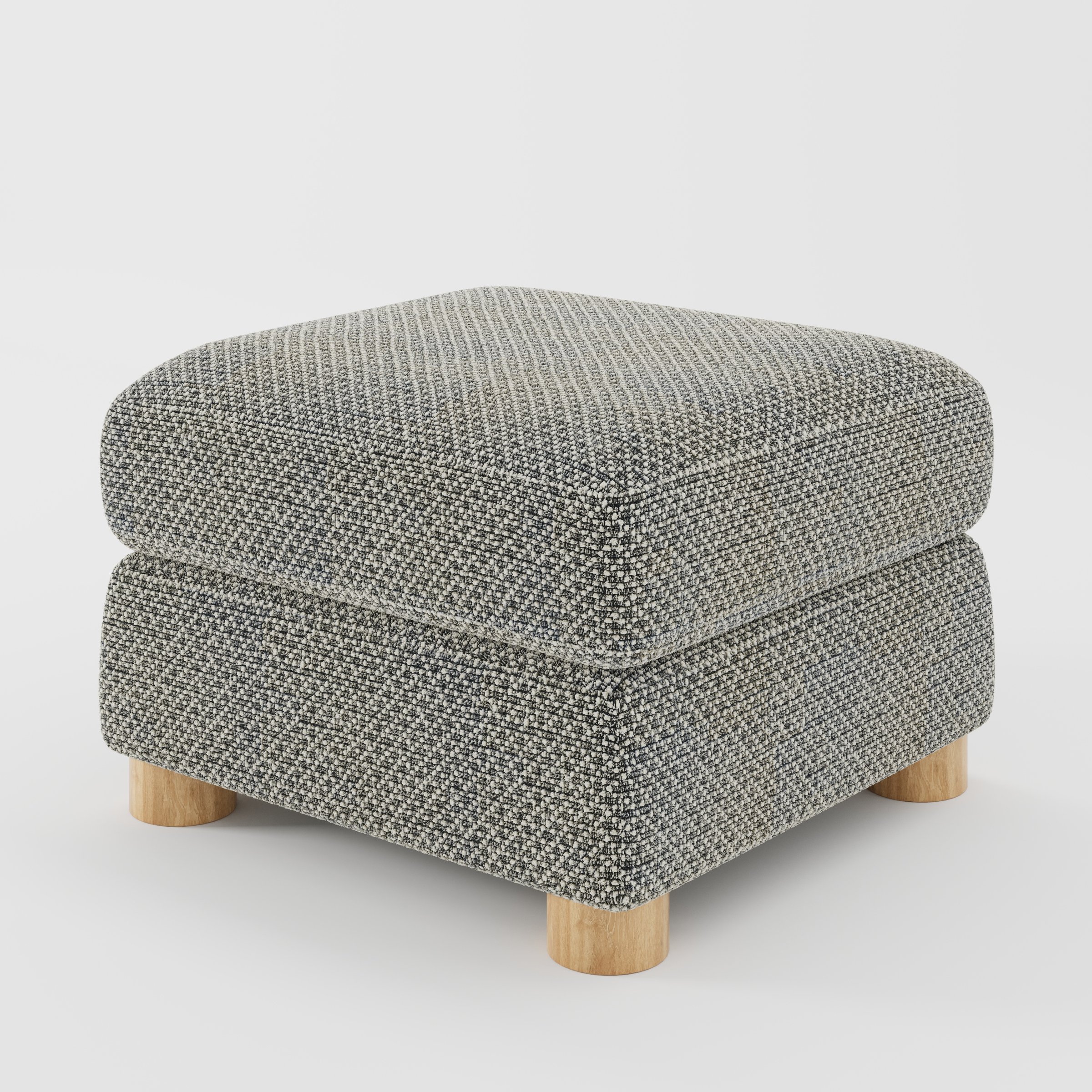 Windermere footstool in Rousay Wool Blend Tar and Chalk shown at a diagonal angle highlighting soft corners and rounded wooden feet.