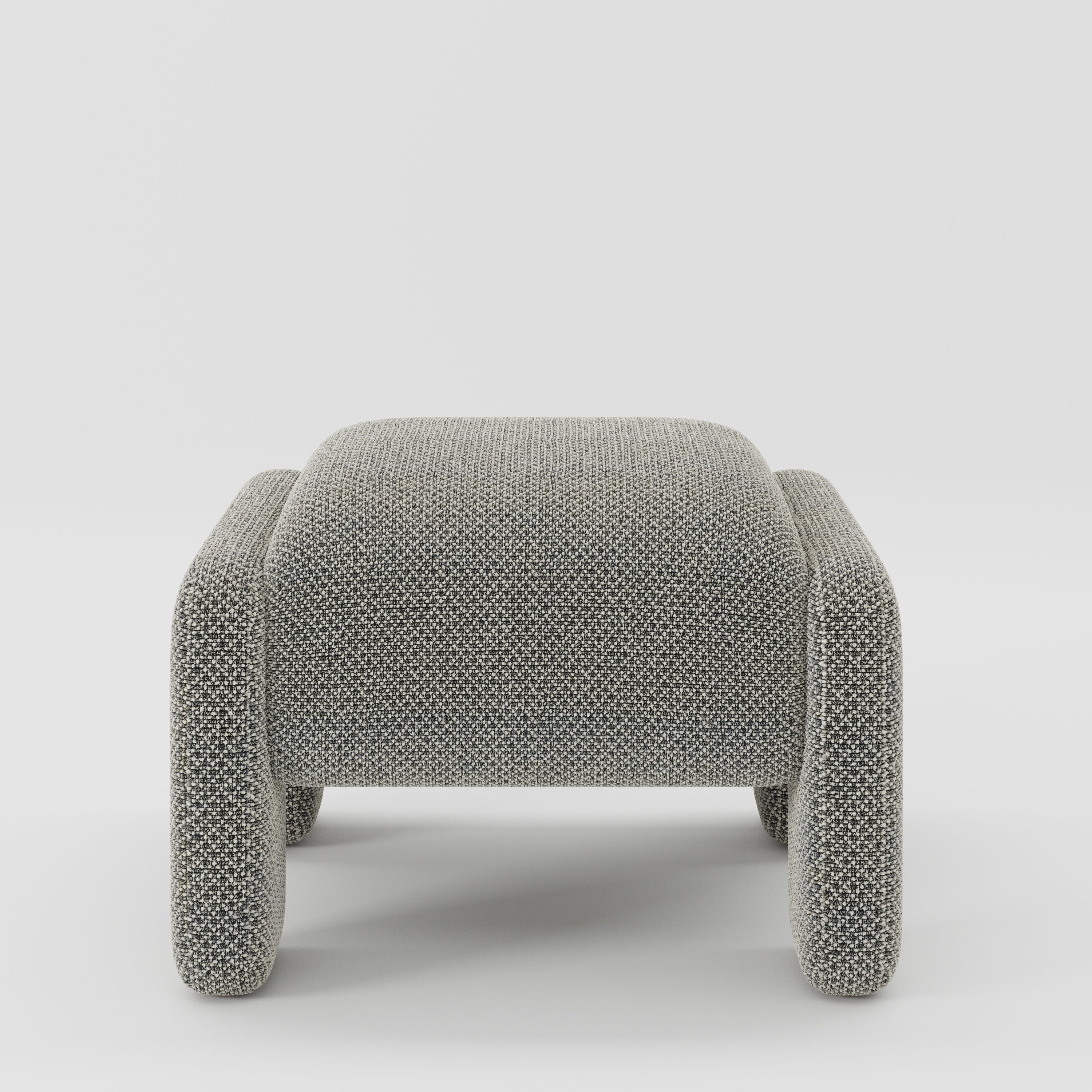 Inny footstool in Rousay wool blend tar and chalk fabric, front view showing rounded form and textured woven finish