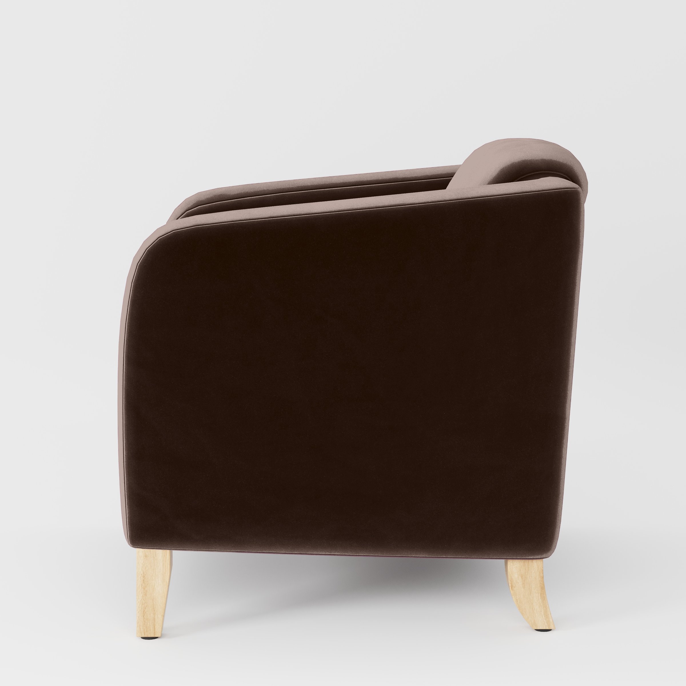 Side view of the Erne armchair upholstered in Plush EasyClean Velvet in Mole.