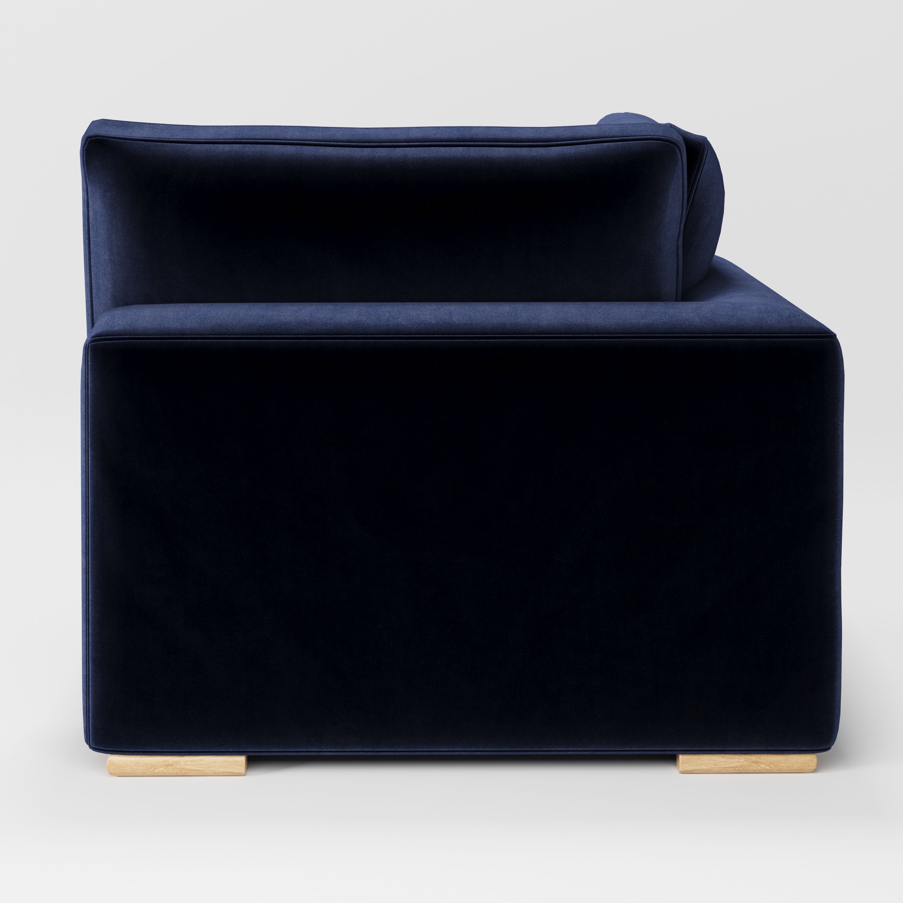 Olton corner unit in Noss velvet navy fabric, back view showing continuous upholstery and clean silhouette