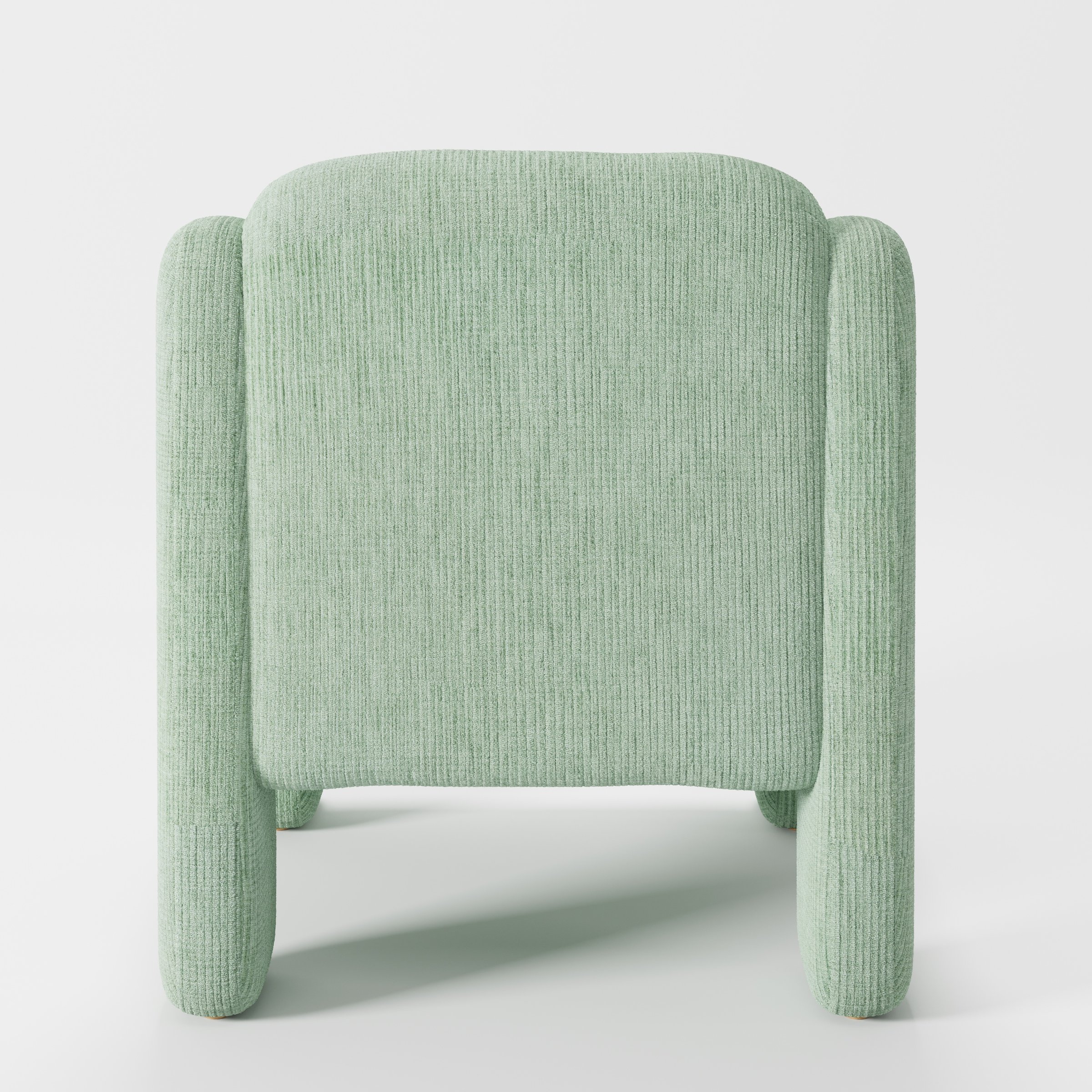Inny armchair in Caldey Velvet Corduroy Eucalyptus shown from the rear highlighting curved backrest and upholstery finish.