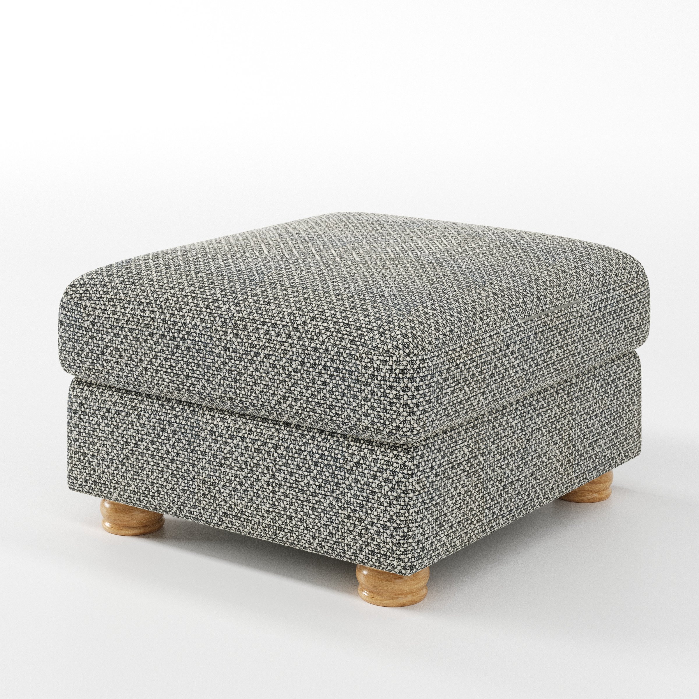 Anna Lee footstool in Rousay Wool Blend Tar and Chalk shown at a diagonal angle highlighting soft cushioning and turned wooden feet.