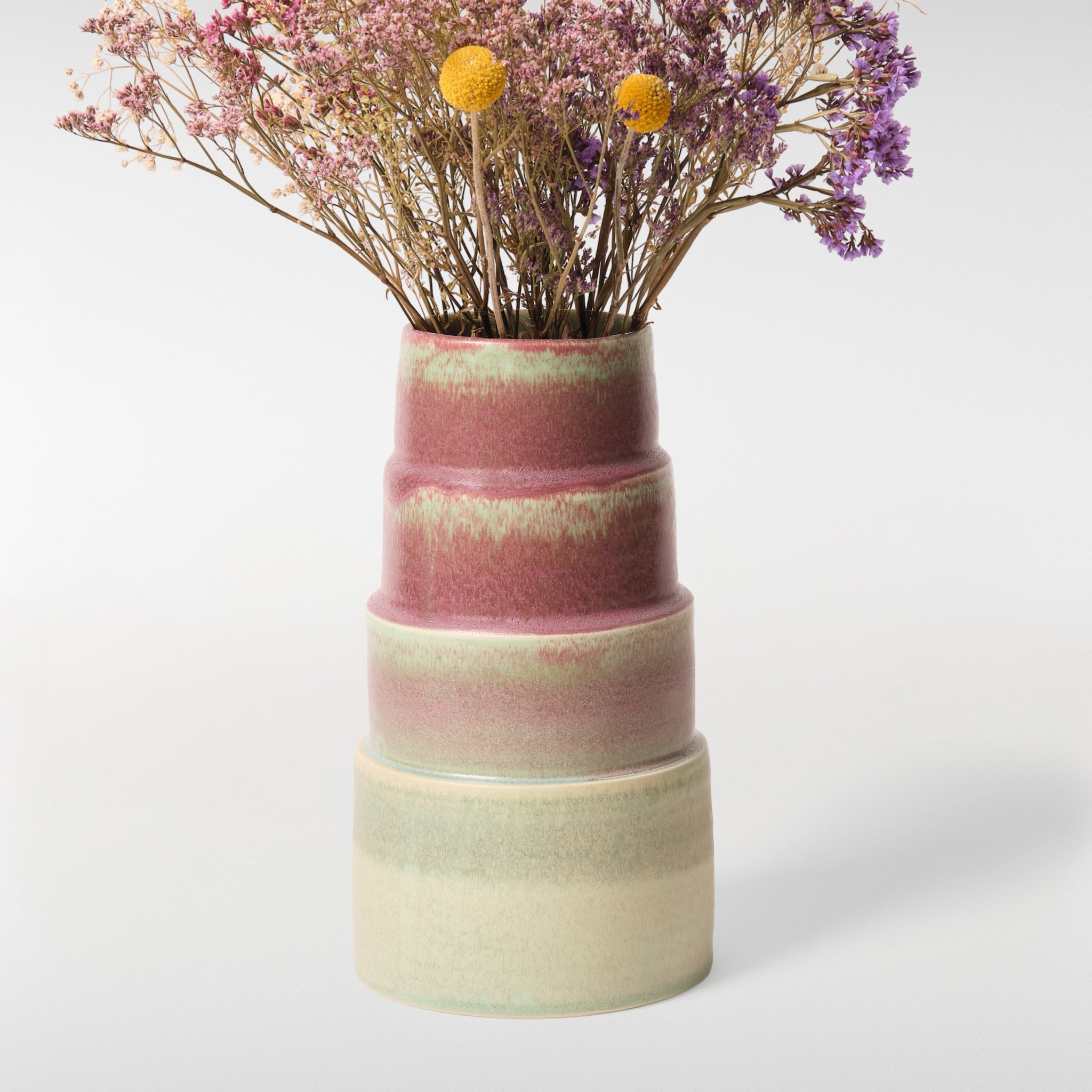 Glint Vase 2 in multicolour glaze with dried flowers, stacked ceramic vase with blended pink, green and cream finish